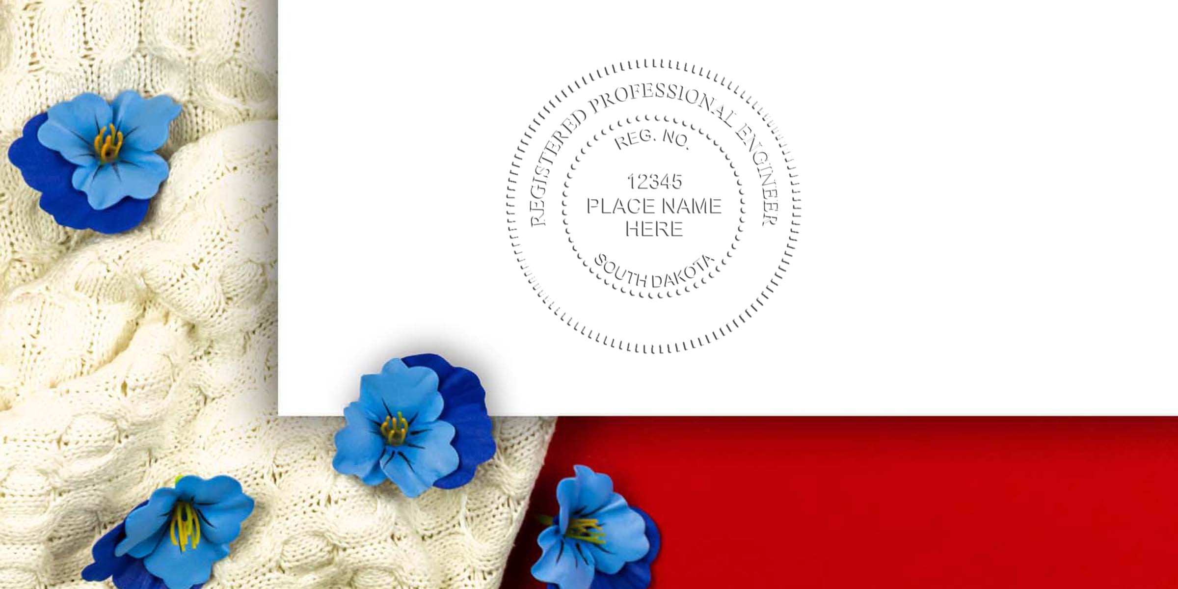 South Dakota PE Stamp, Professional Engineer embossed on white paper with blue flowers and knitted fabric background.