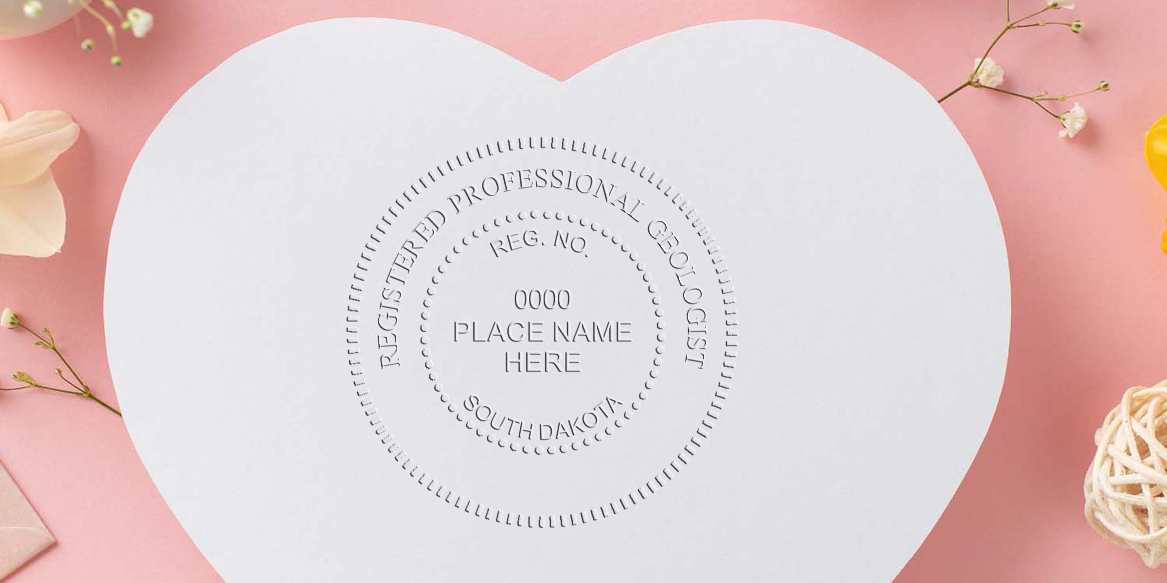 South Dakota geologist seal on heart-shaped paper with flowers and pink background, showing registered professional geologist certification stamp per seal regulations.