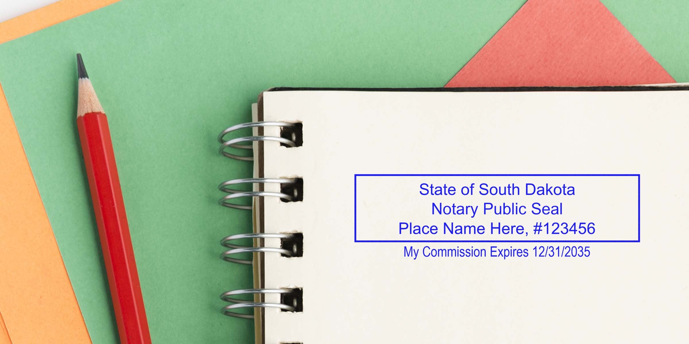 SD notary stamp on notebook with red pencil and colorful paper, symbolizing trusted notary services in South Dakota.