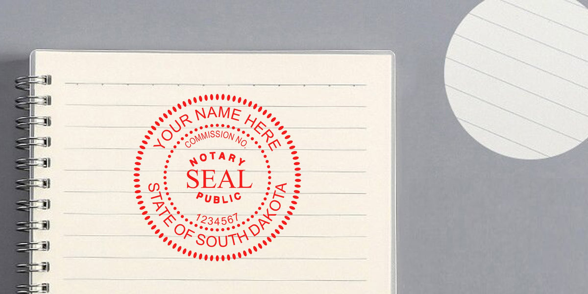 South Dakota Notary Seal stamp on lined notebook for verifying commission number and Notary Public details.