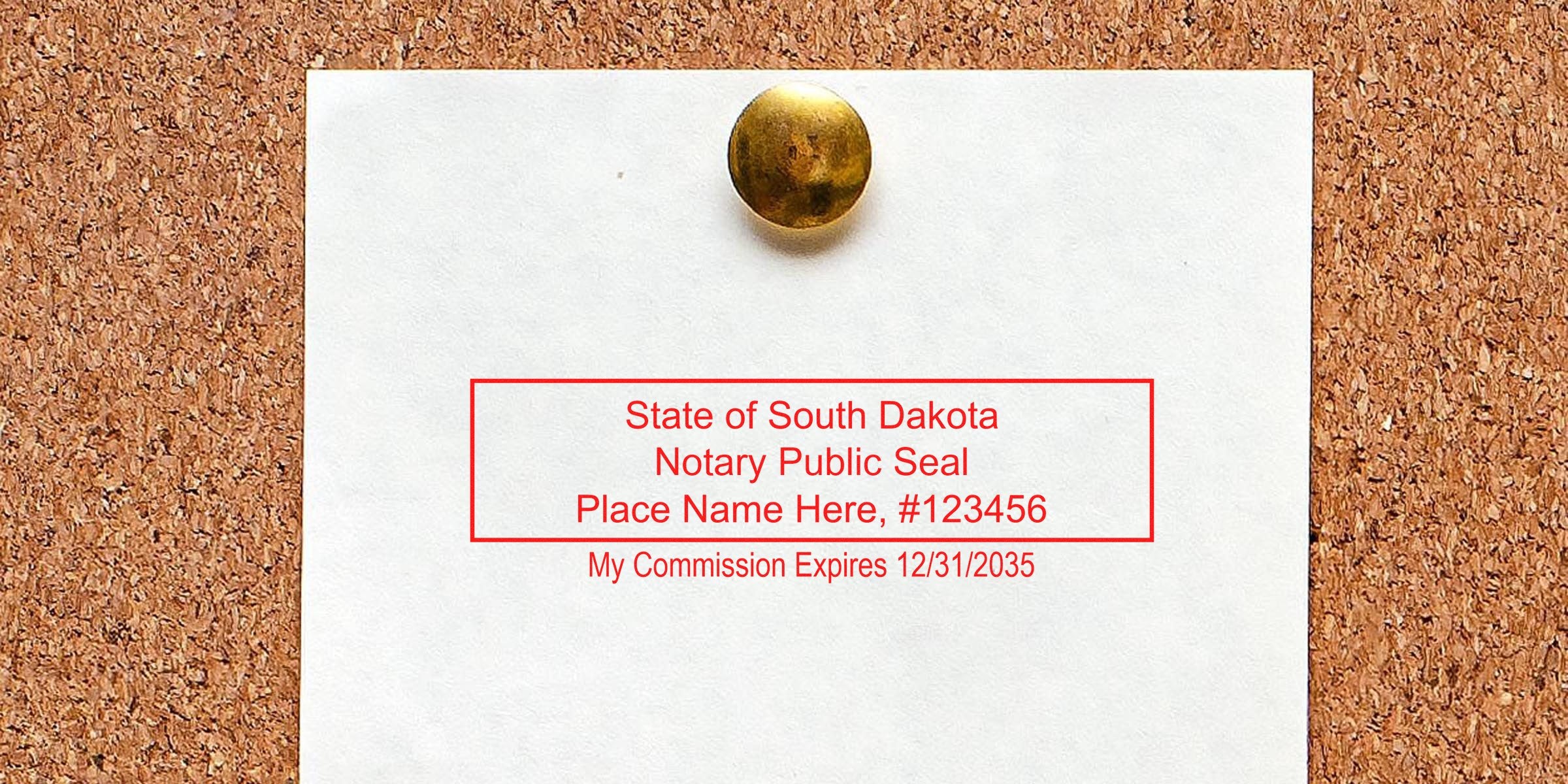 South Dakota notary seal on white paper pinned to corkboard with brass thumbtack, displaying the seal and its dimensions.