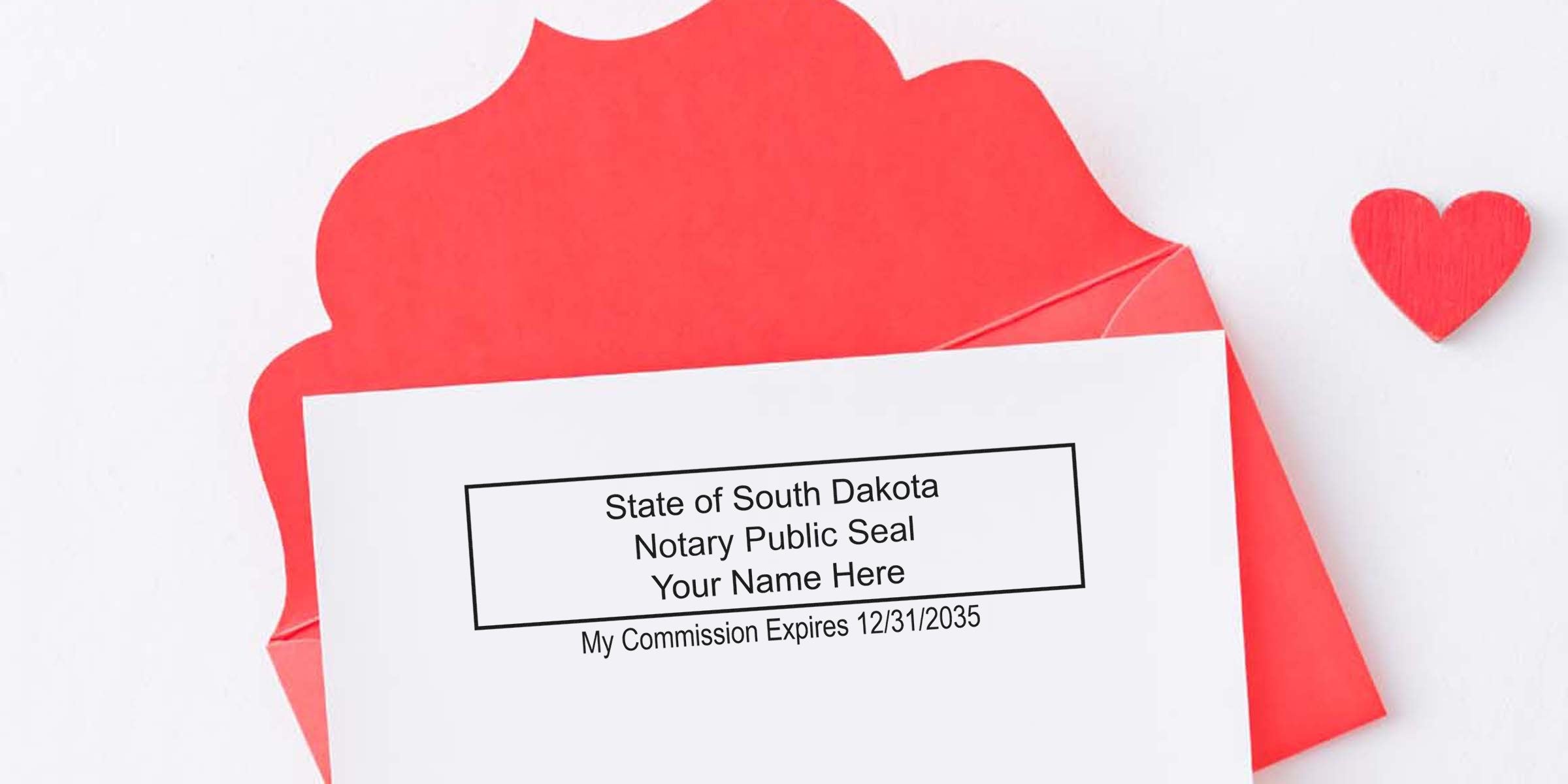 South Dakota notary seal on white card with red envelope and heart, showcasing notary supplies and essentials for commission renewal.