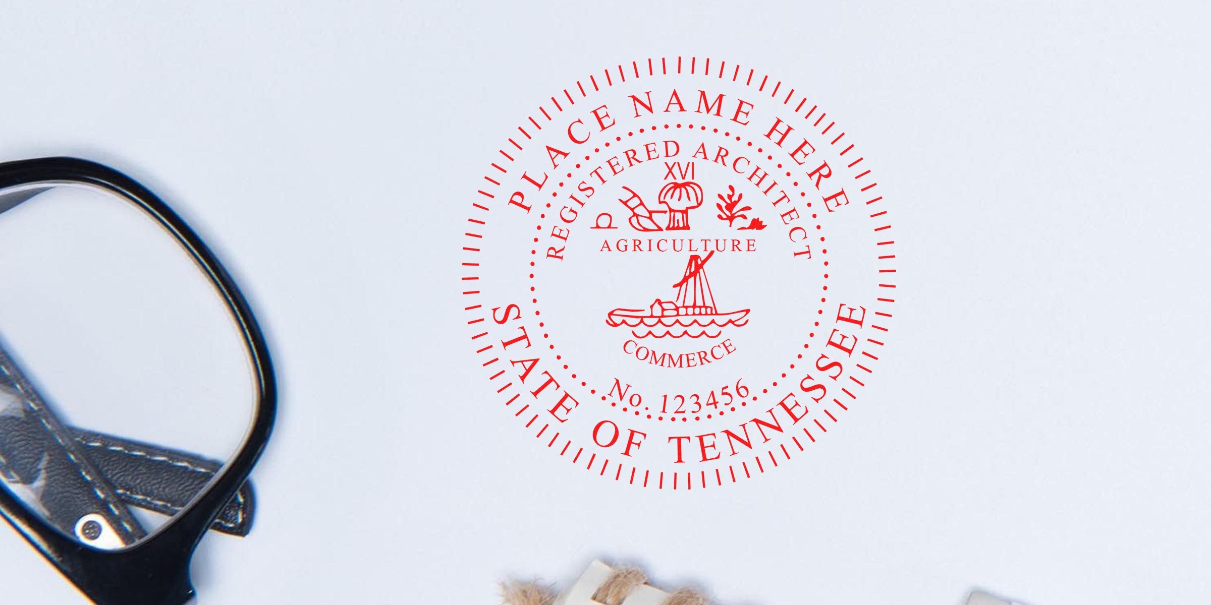 Tennessee notary seal stamp with glasses and office supplies on white background, showcasing custom and Tennessee architect stamps.