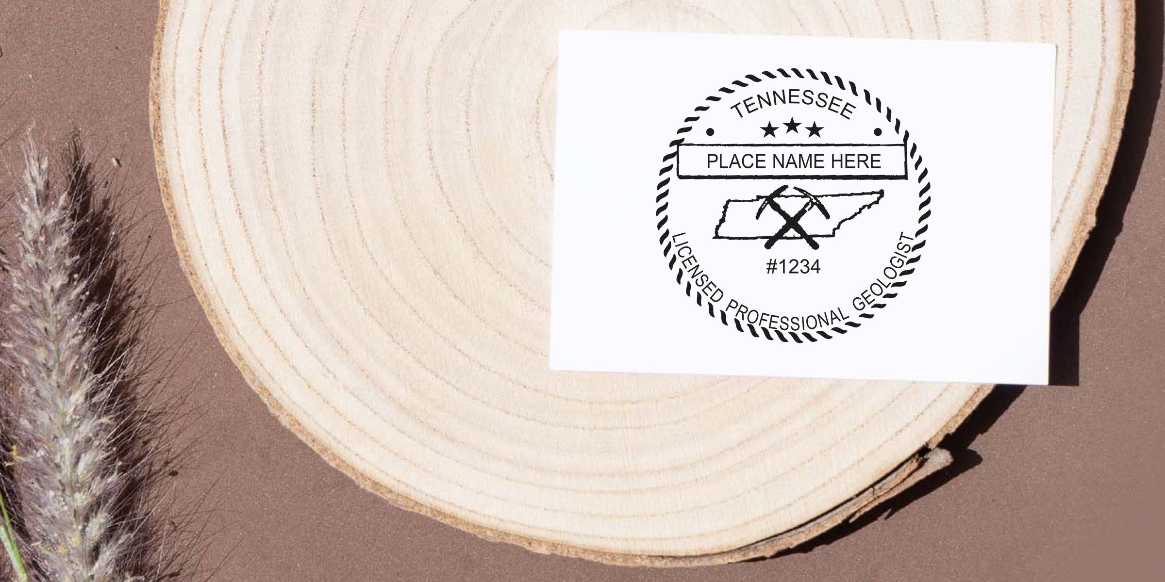 Tennessee licensed professional geologist stamp on white card with dried grass, showcasing cost and budget-friendly geologist stamp options.