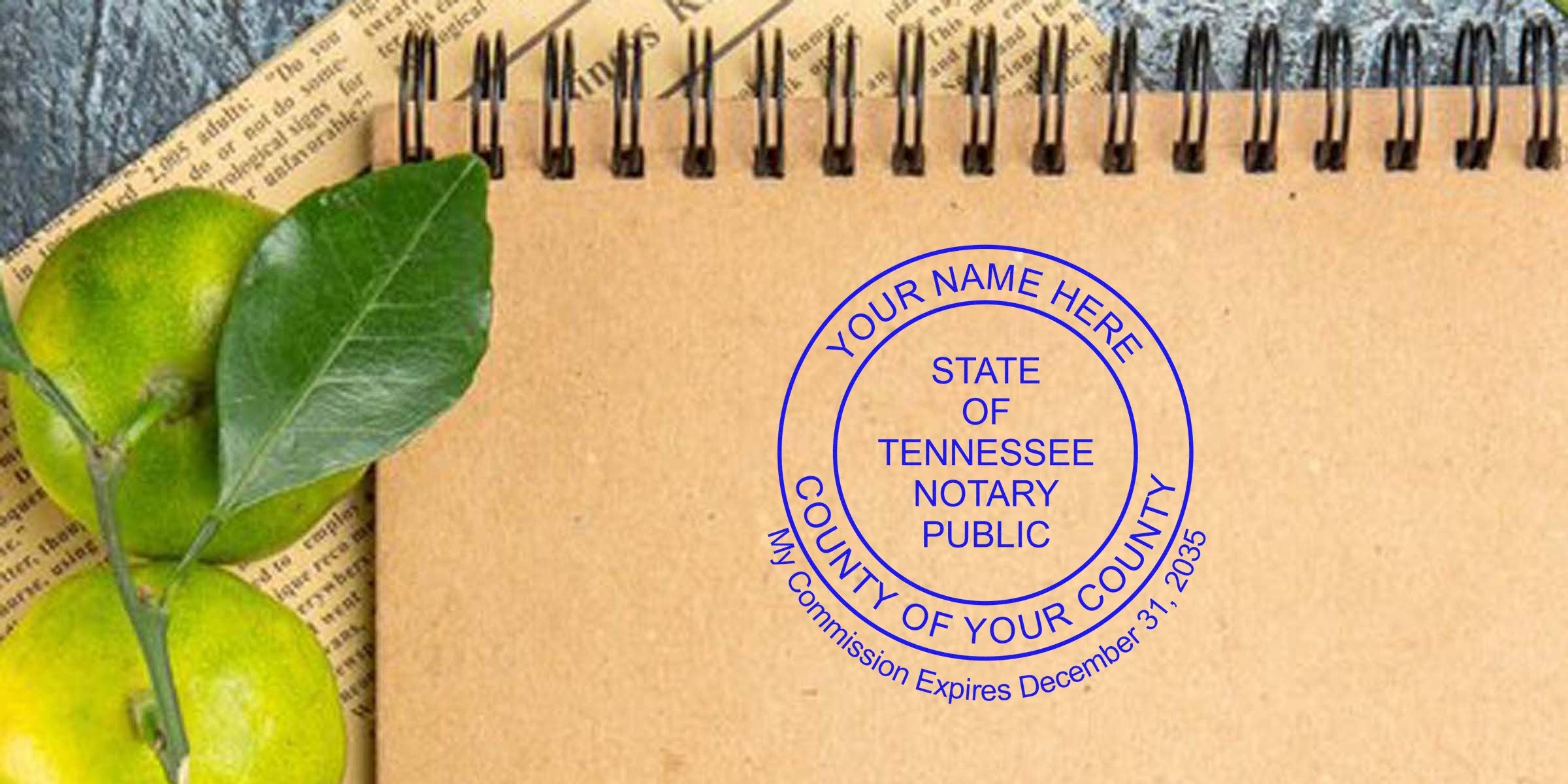 Tennessee notary public stamp on brown notebook, surrounded by notary supplies, essentials, green leaves, and a newspaper background.