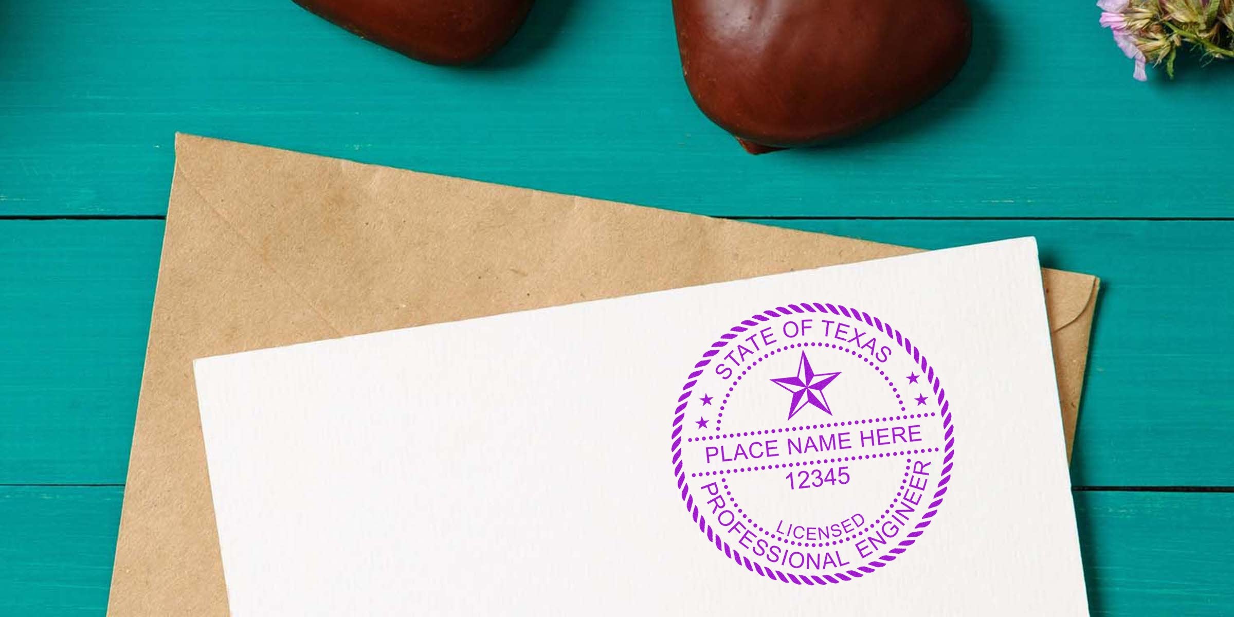 Texas engineer stamp and professional seal on white paper with envelope, placed on a turquoise wooden background.