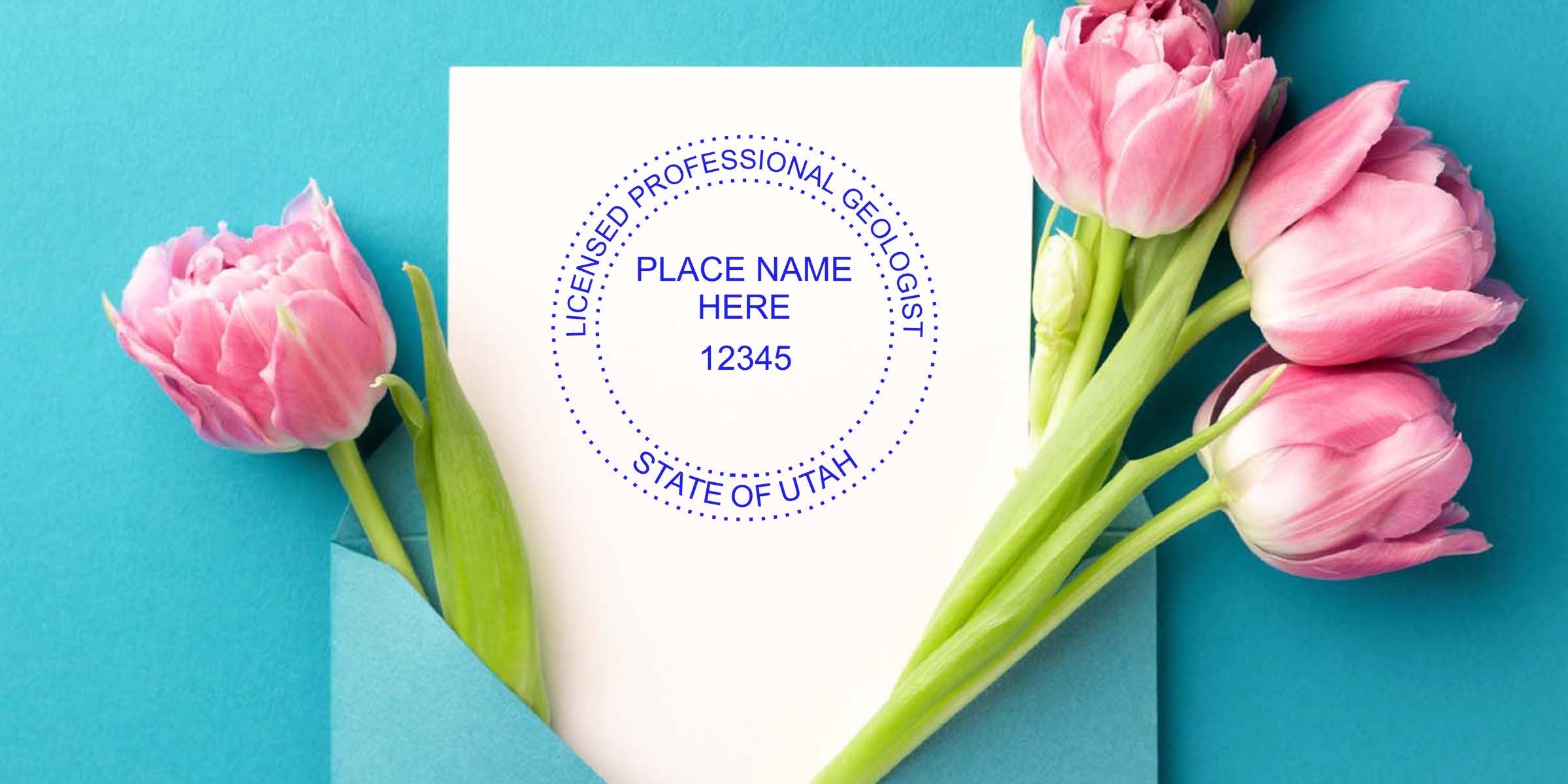 Pink tulips next to a white card with a Utah geologist stamp, blue envelope on turquoise background, showcasing Utah geologist stamp cost and fees.