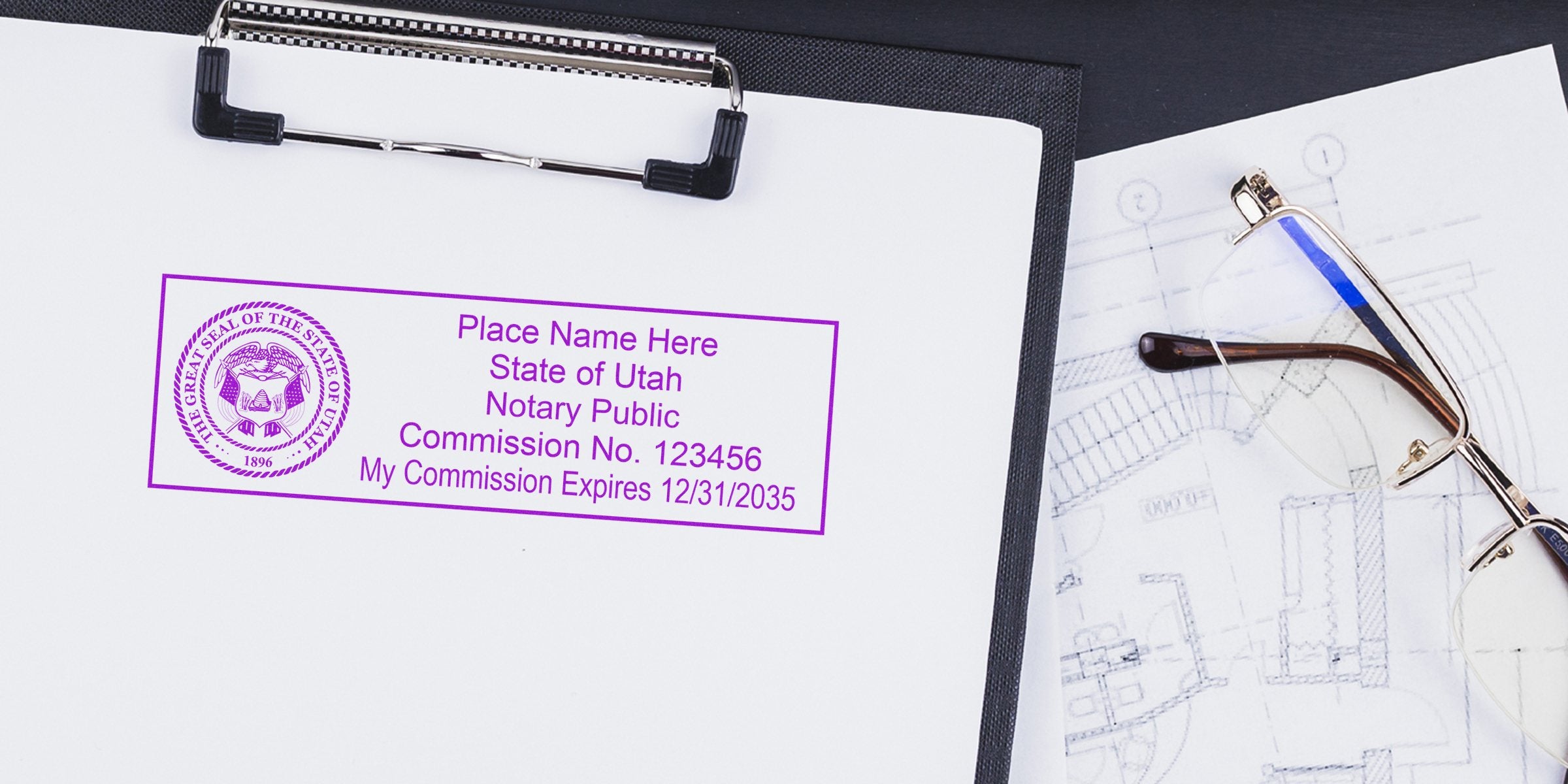Utah notary stamp on clipboard with blueprint and glasses, highlighting Utah notary stamp renewal and renewal requirements.