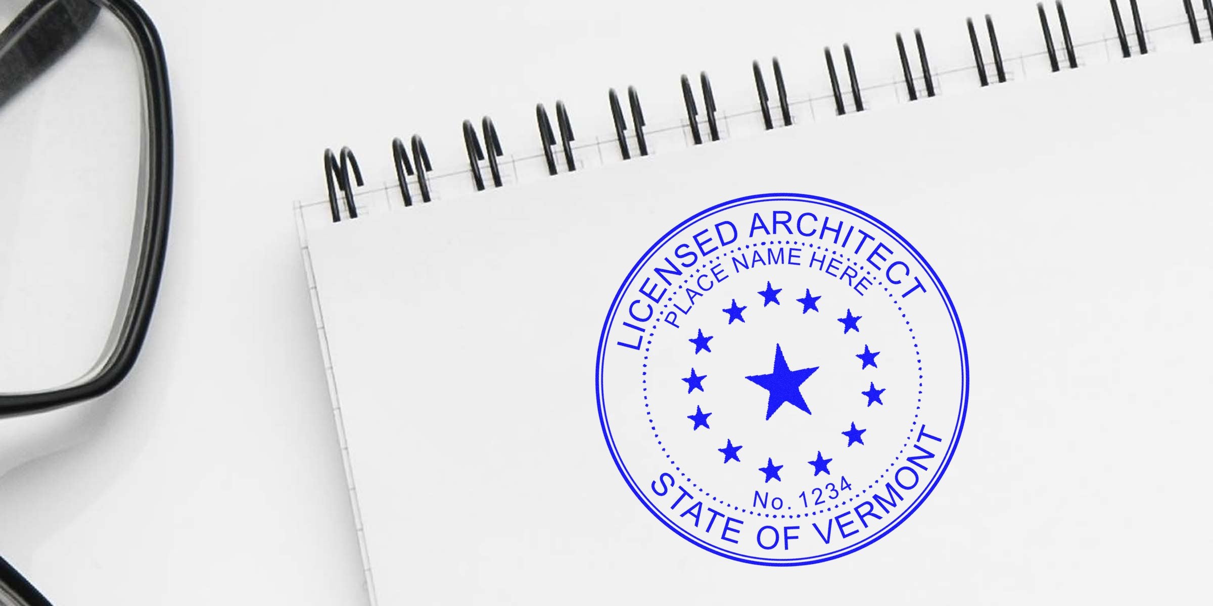 Licensed Architect Stamp Vermont on notebook with glasses, showing official Vermont state architect license seal and Online Architect Stamp.