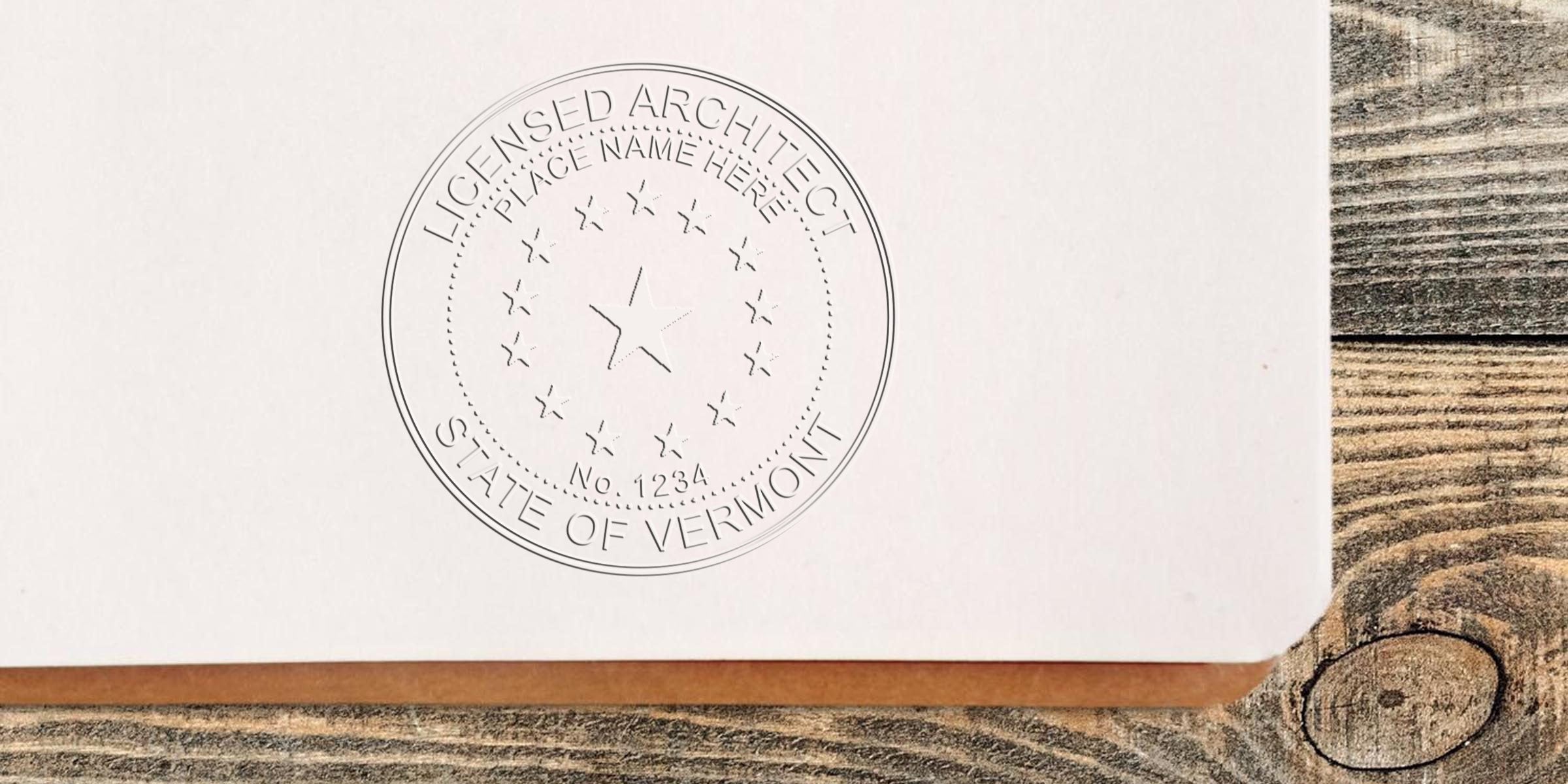 Licensed Vermont architect stamp on paper meets architect seal certification requirements.