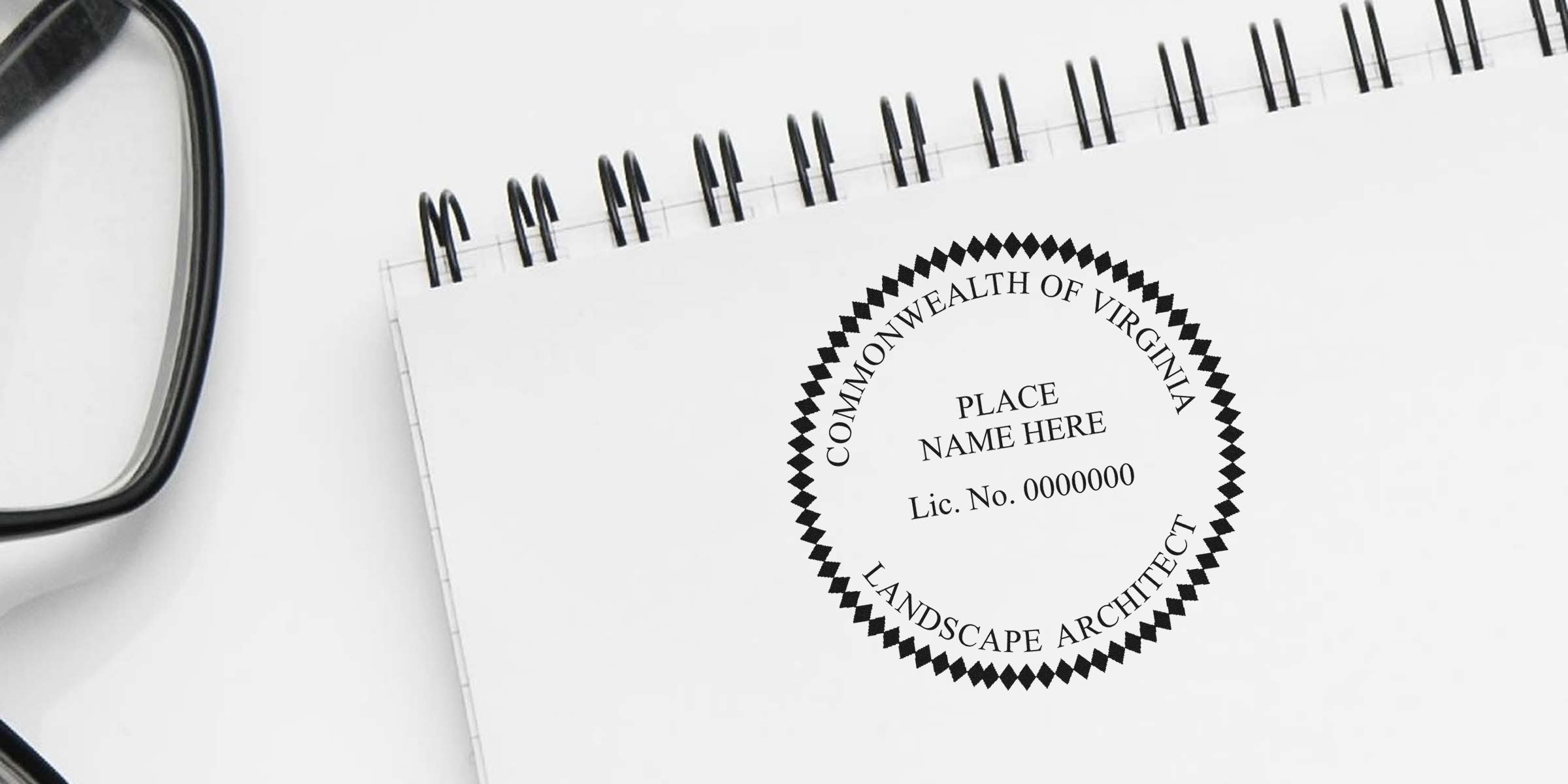Commonwealth of Virginia landscape architect license seal on spiral notebook with glasses on white desk, highlighting Virginia landscape architect stamp cost and fees.
