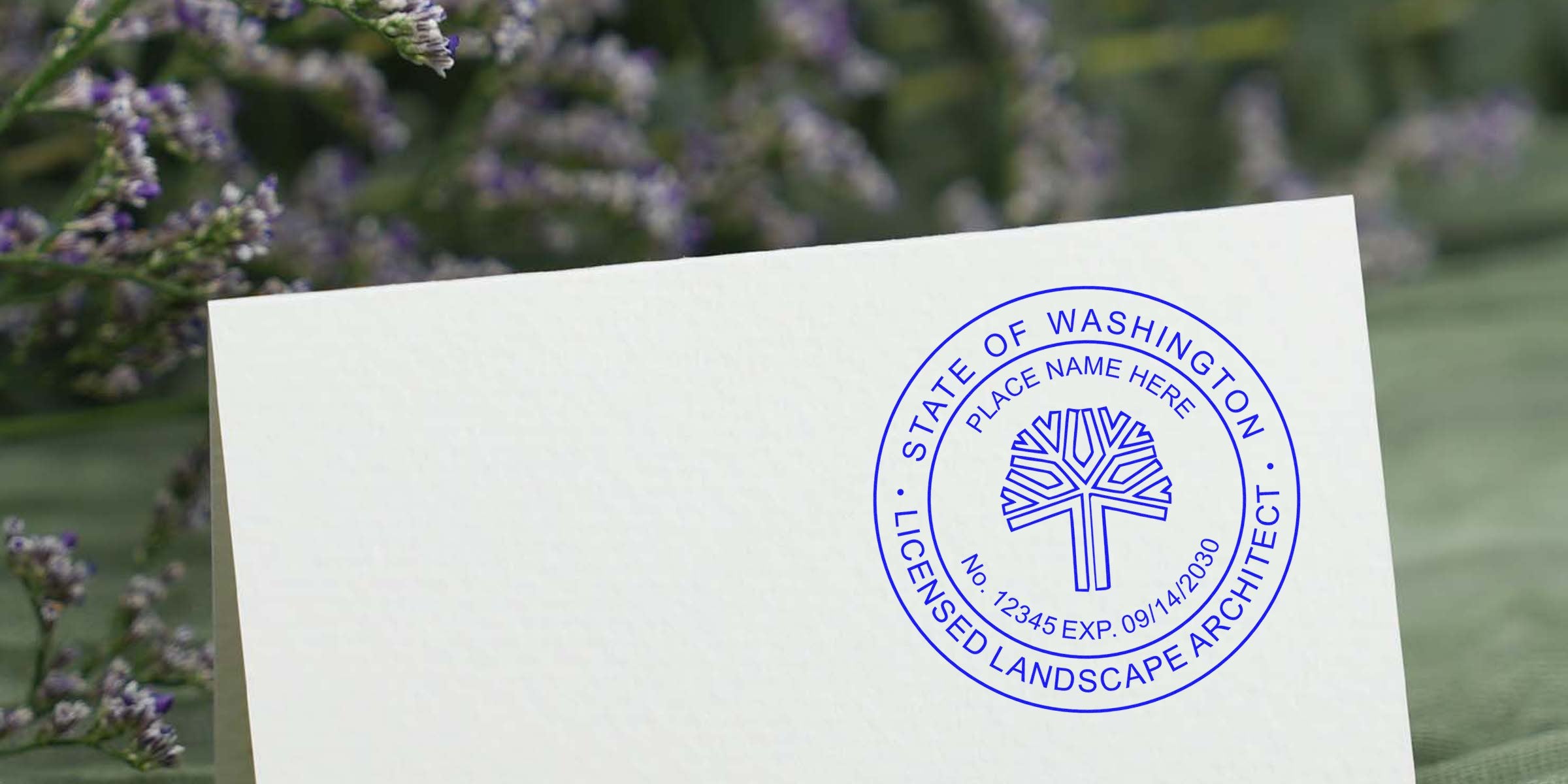 Washington landscape architect license stamp on white paper with a floral backdrop.