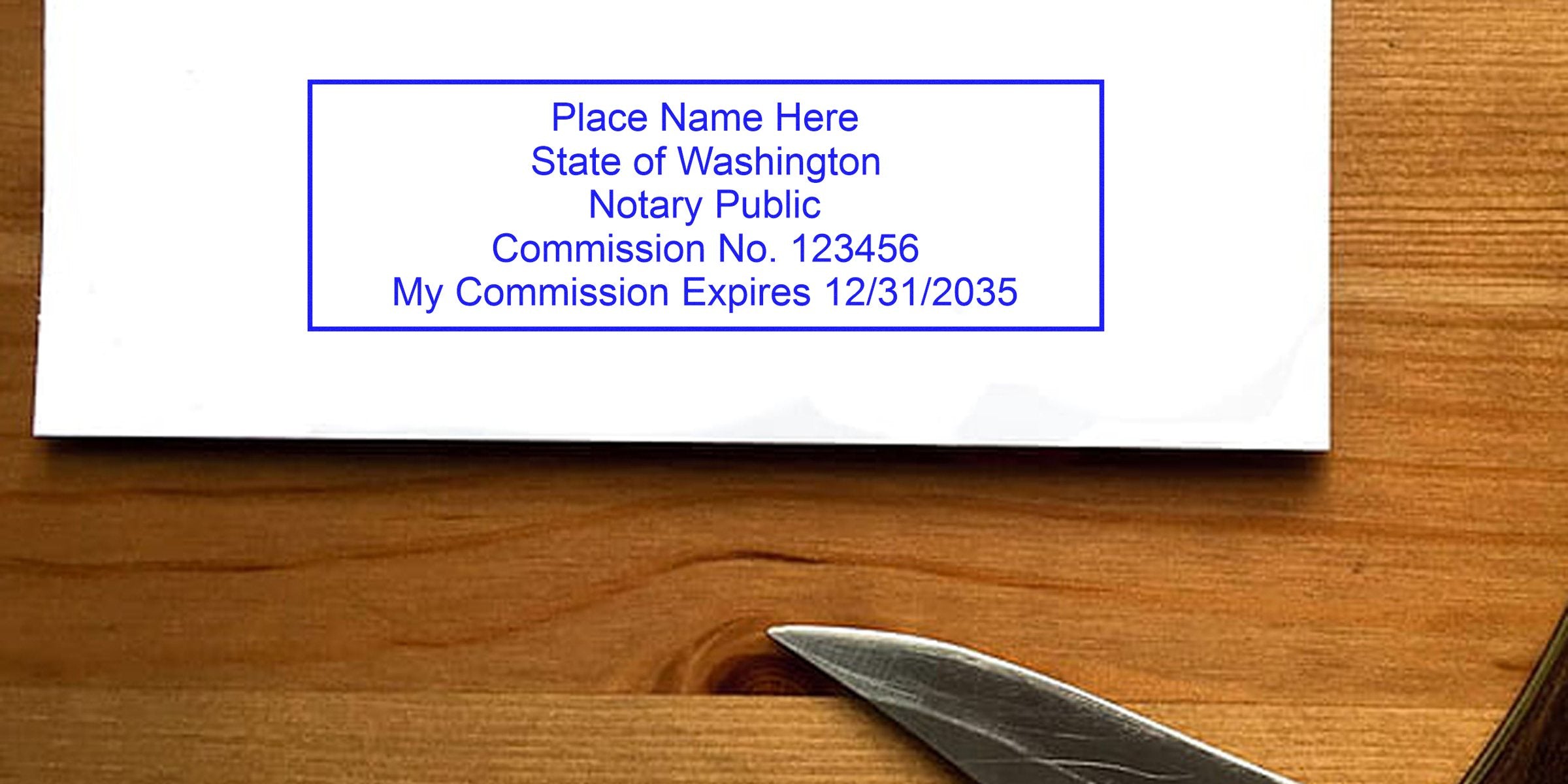Quality Washington Notary Public stamp resting on a wooden desk with a knife edge.
