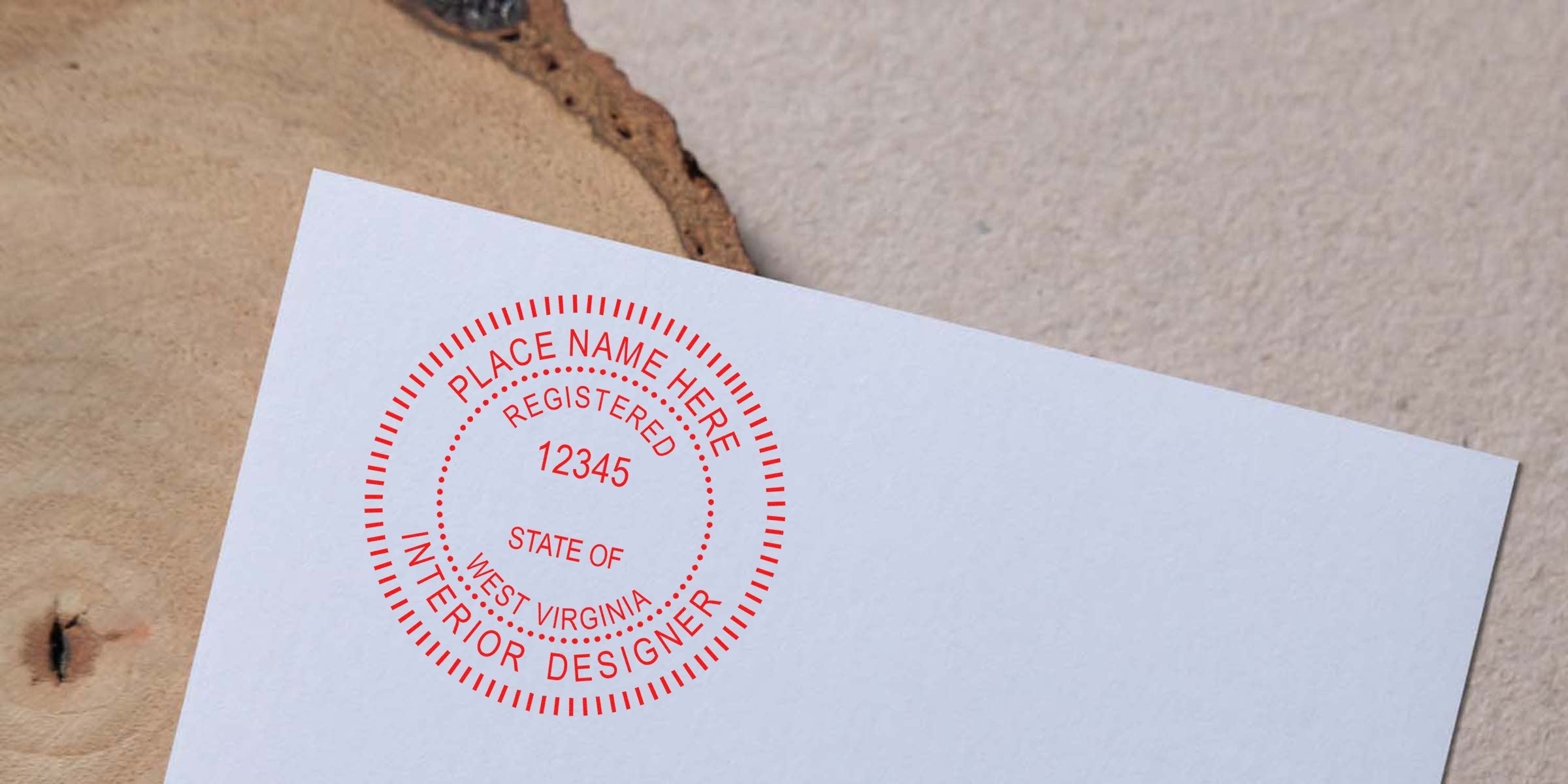 West Virginia interior designer’s registered seal stamp on white paper with wood background, meeting WV interior design stamp and licensing standards.