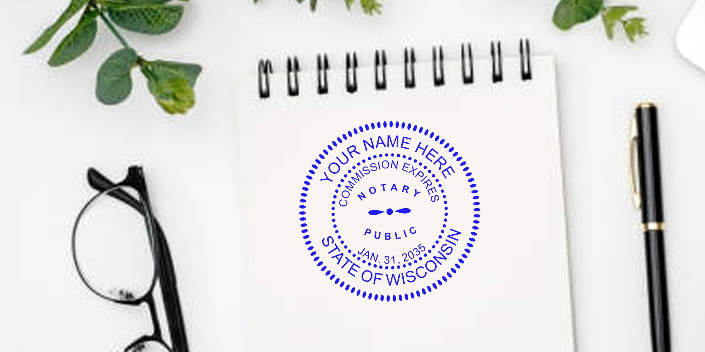 Wisconsin notary stamp on white notebook with black pen and glasses, showcasing affordable notary supplies on desk.