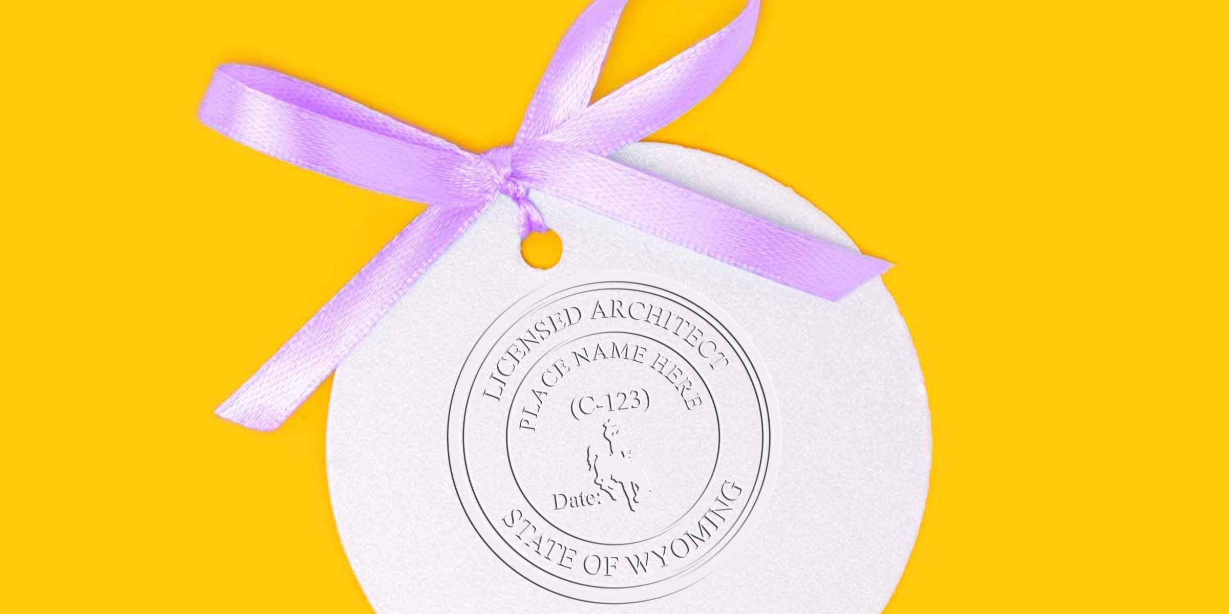 Wyoming architect stamp with licensed architect seal, purple ribbon on yellow background, highlighting custom stamp options.