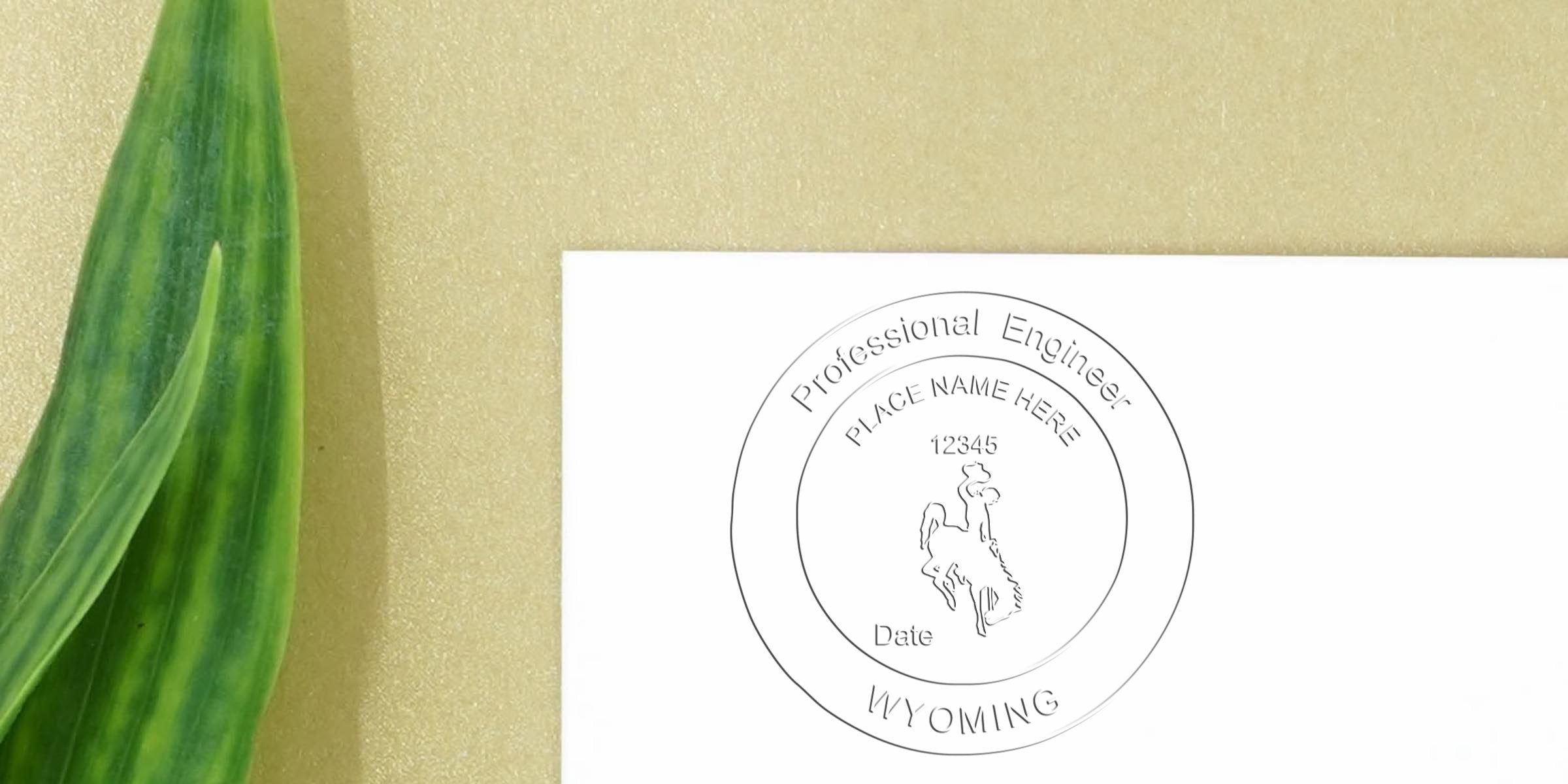 Professional Engineer Stamp Wyoming on white paper with green leaf, gold background. Buy PE Stamp Wyoming now.