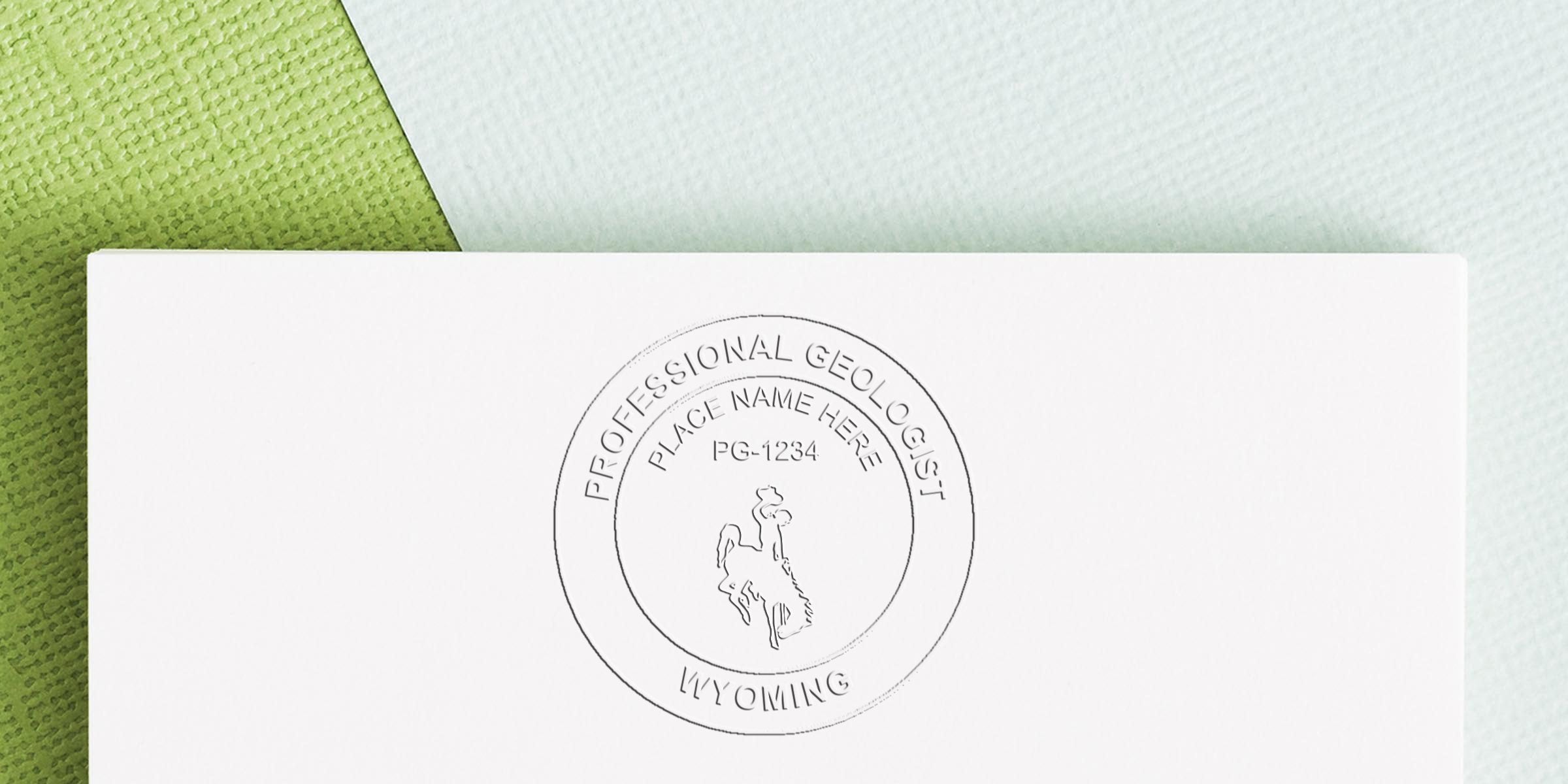 Wyoming Geologist Seal with cowboy logo stamped on white paper for geologist certification in Wyoming.