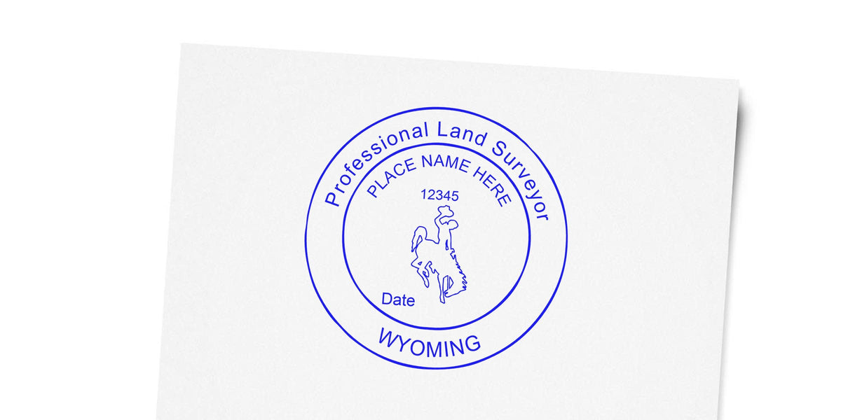 Wyoming land surveyor seal with a cowboy logo and place name, designed as a professional embosser stamp guide.