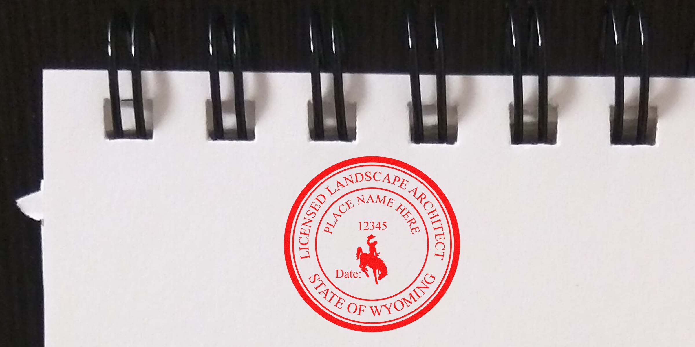Wyoming landscape architect stamp on spiral notebook, licensed architect seal, order architect stamps online.