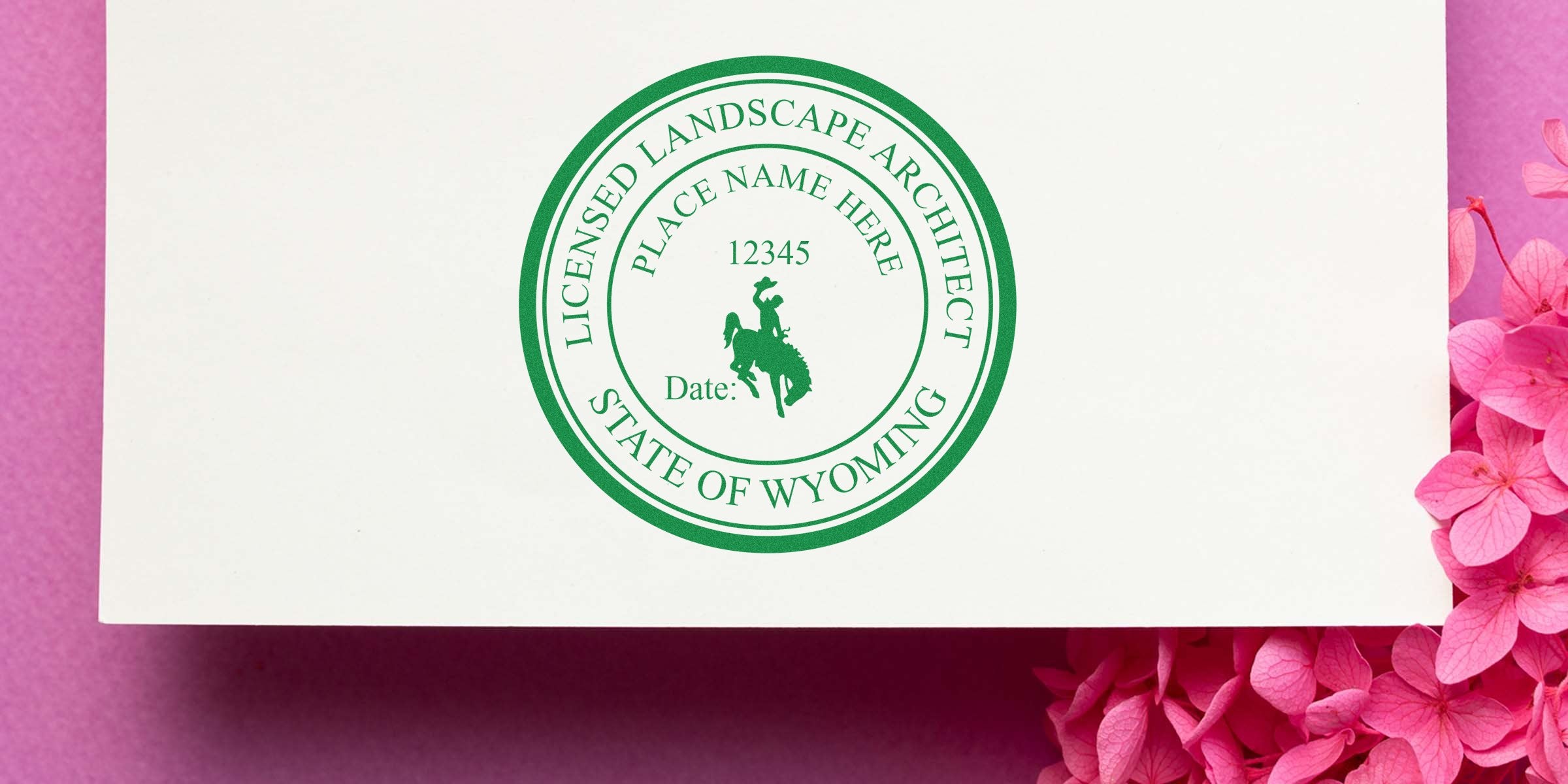 Wyoming landscape architect stamp with licensed architect seal on white paper, adorned with pink flowers, displaying the stamp size.