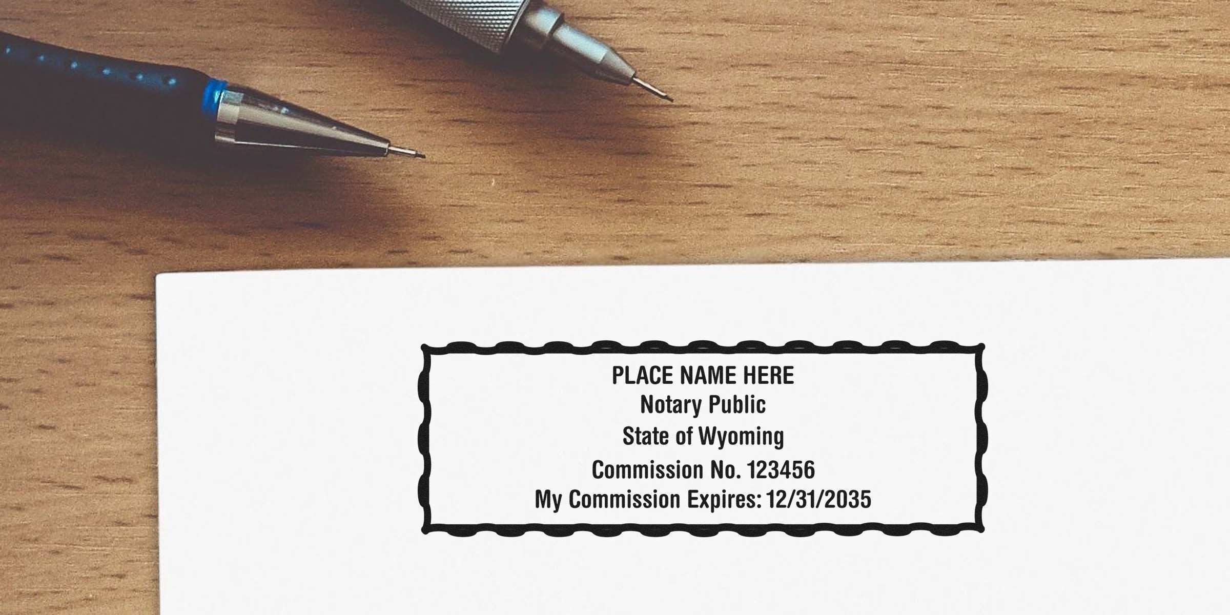 Wyoming notary stamp on paper with commission details, pens on wooden desk, ensuring notary compliance in Wyoming.