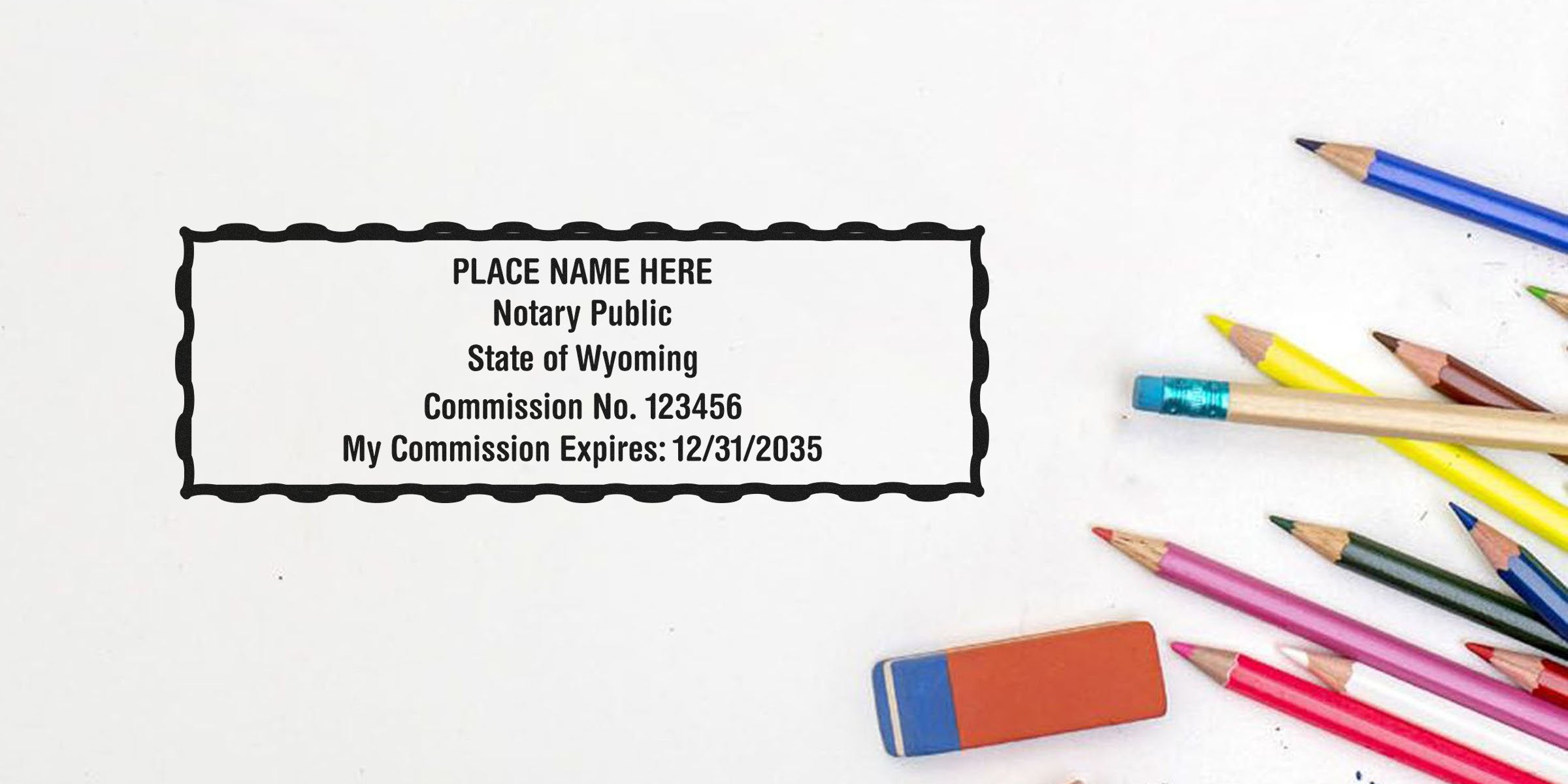 Wyoming notary public stamp with colored pencils and eraser on white background, related to Wyoming notary stamp renewal and renewal requirements.