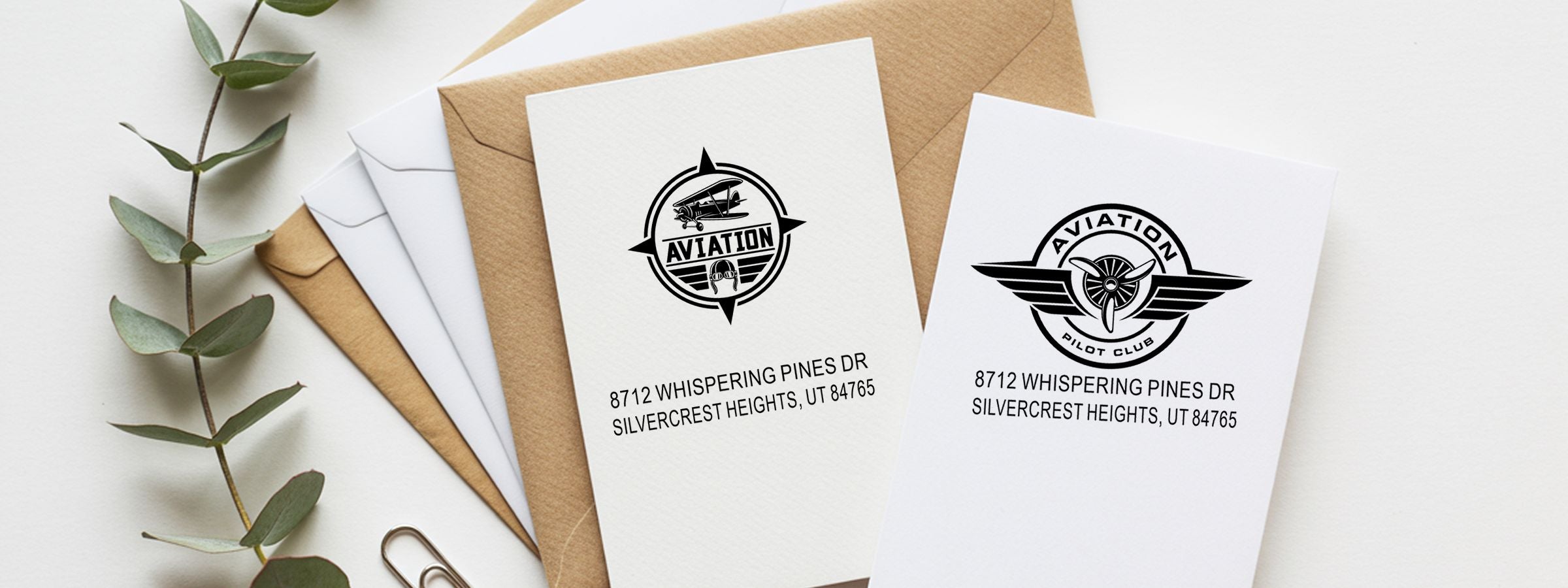 Aviation Designer Stamps on Aviation and Pilot Club invitation cards with kraft envelopes, leafy branch, and 8712 Whispering Pines Dr.