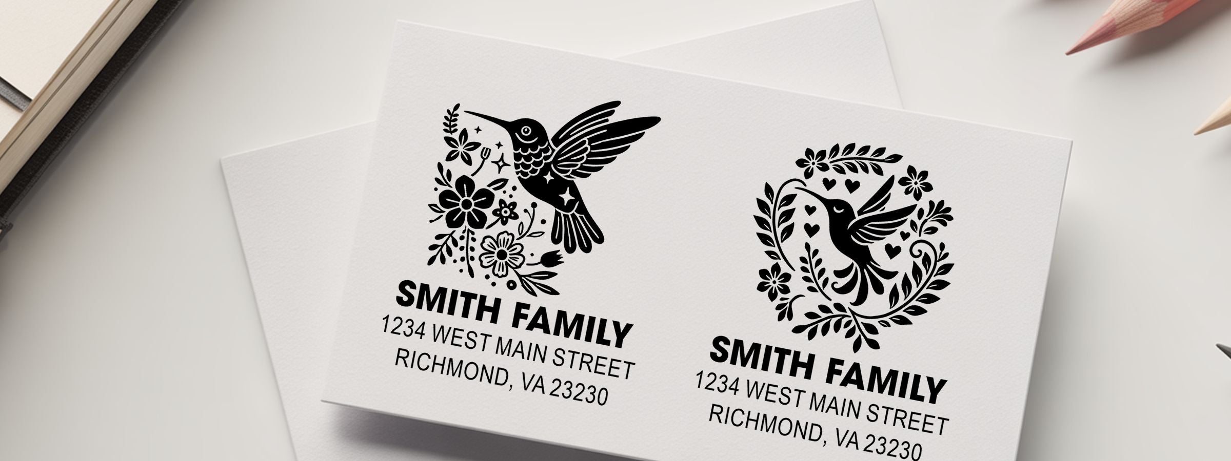 Two personalized white cards with black hummingbird floral logo, Smith Family name, and address, made with Birds and Butterflies Designer Stamps.