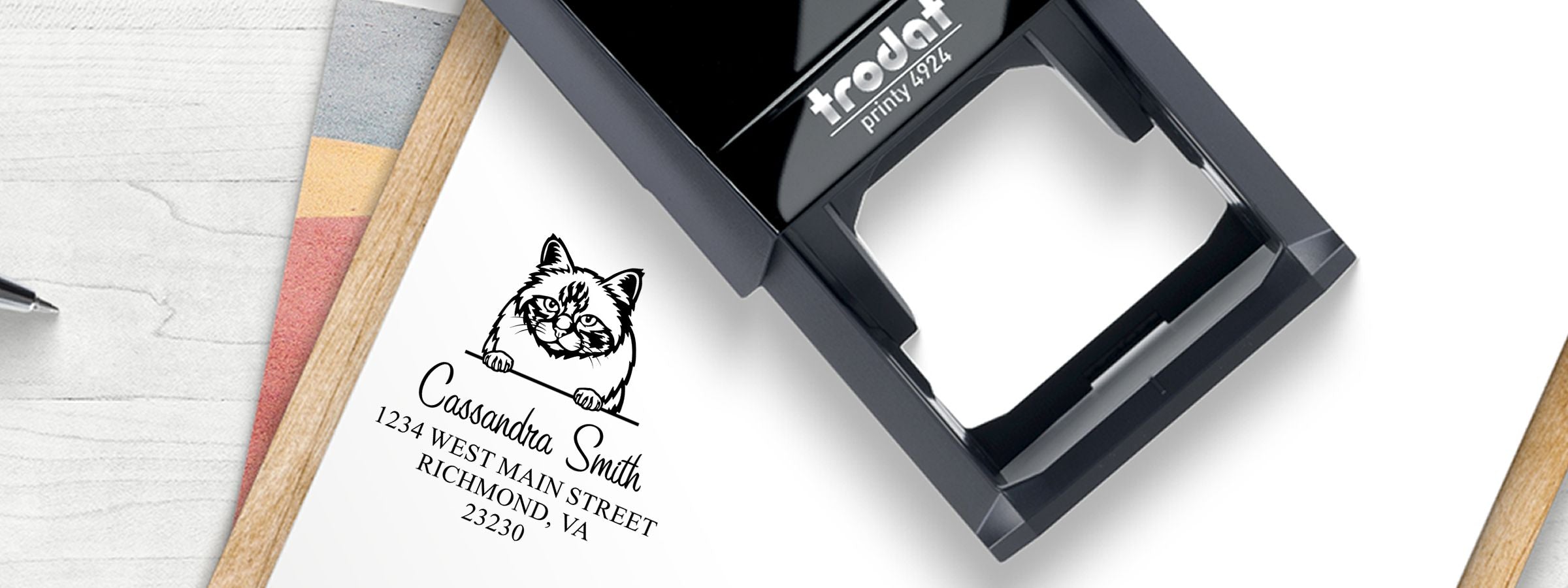 Black Trodat stamp prints a cat logo, Cassandra Smith, and Richmond, VA address for Birman Cat Stamps and Custom Seals.