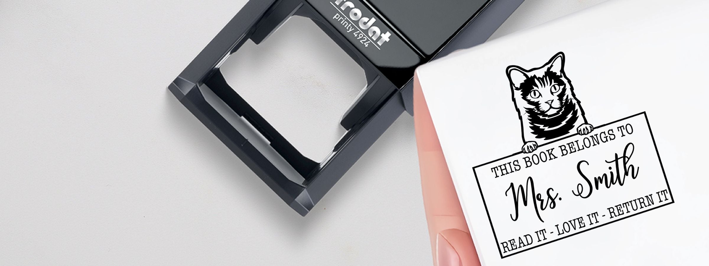 Black book embosser and cat bookplate, “This book belongs to Mrs. Smith” with “Read it - love it - return it.” Chartreux Cat Stamps and Custom Seals