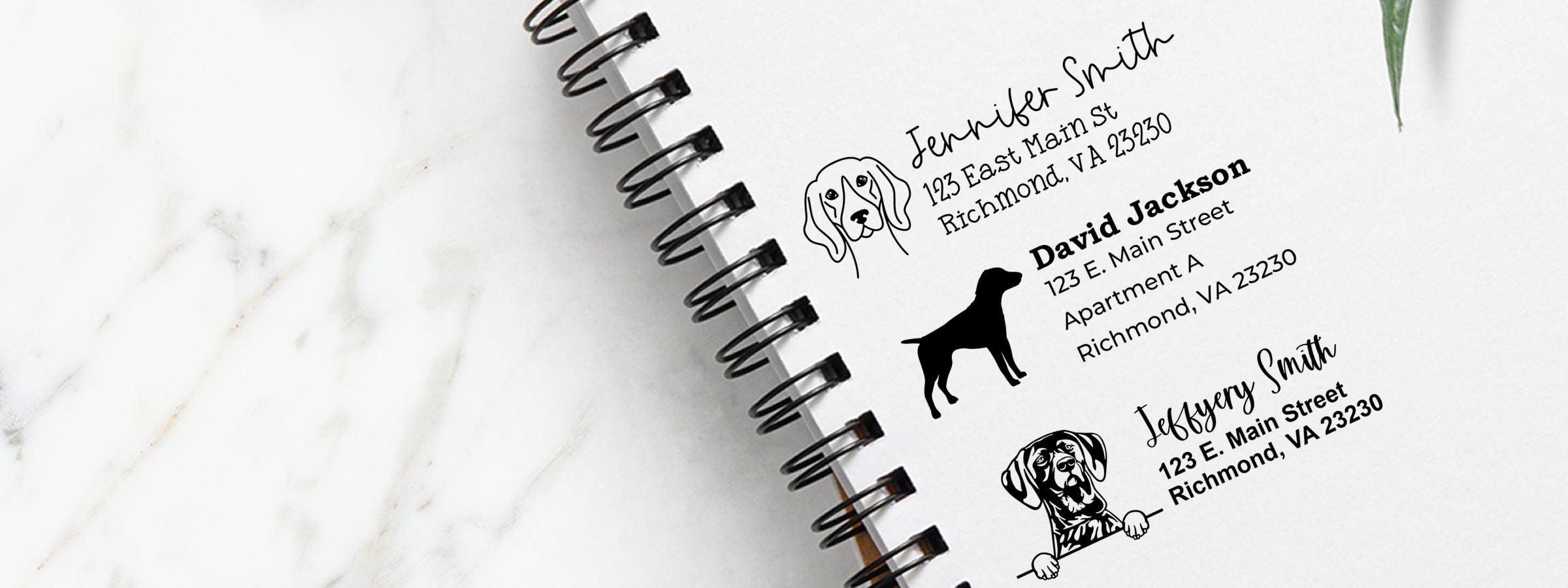 Open spiral notebook with pet contact labels, dog illustrations, and German Shorthaired Pointer Dog Stamps and Custom Seals.