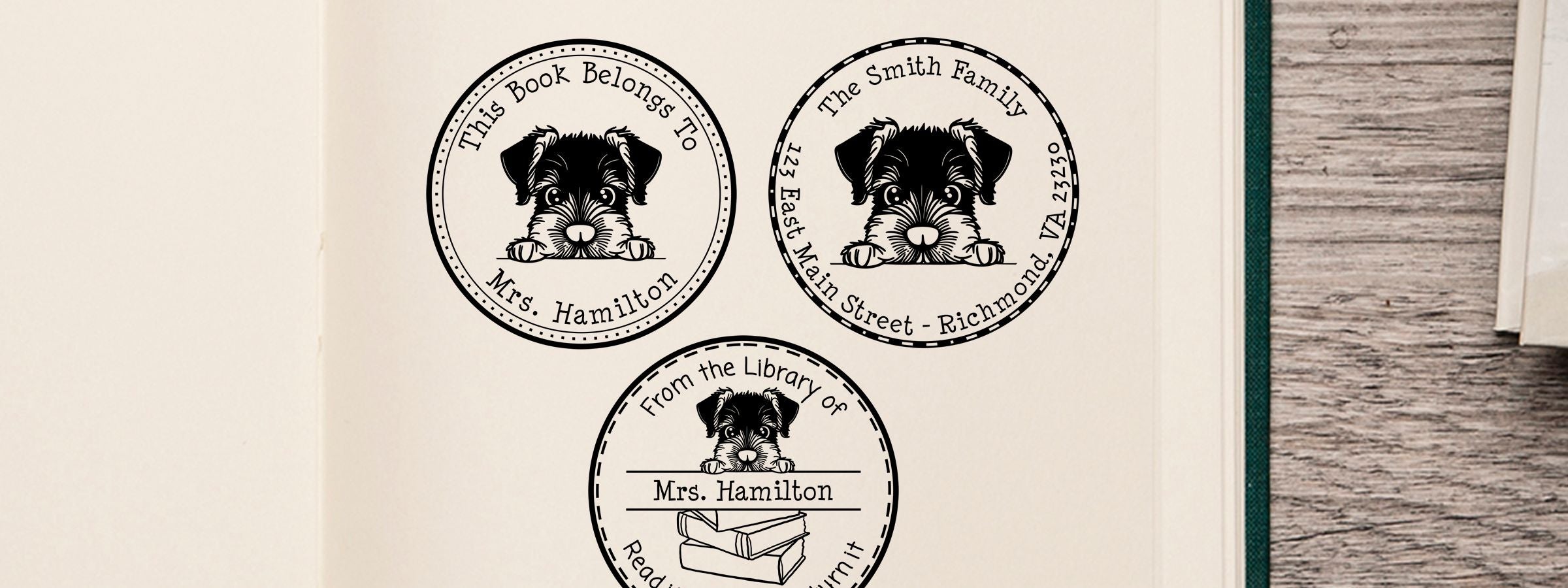 Three personalized black-and-white bookplate labels with a Giant Schnauzer Dog Stamps and Custom Seals puppy illustration on an open book page.