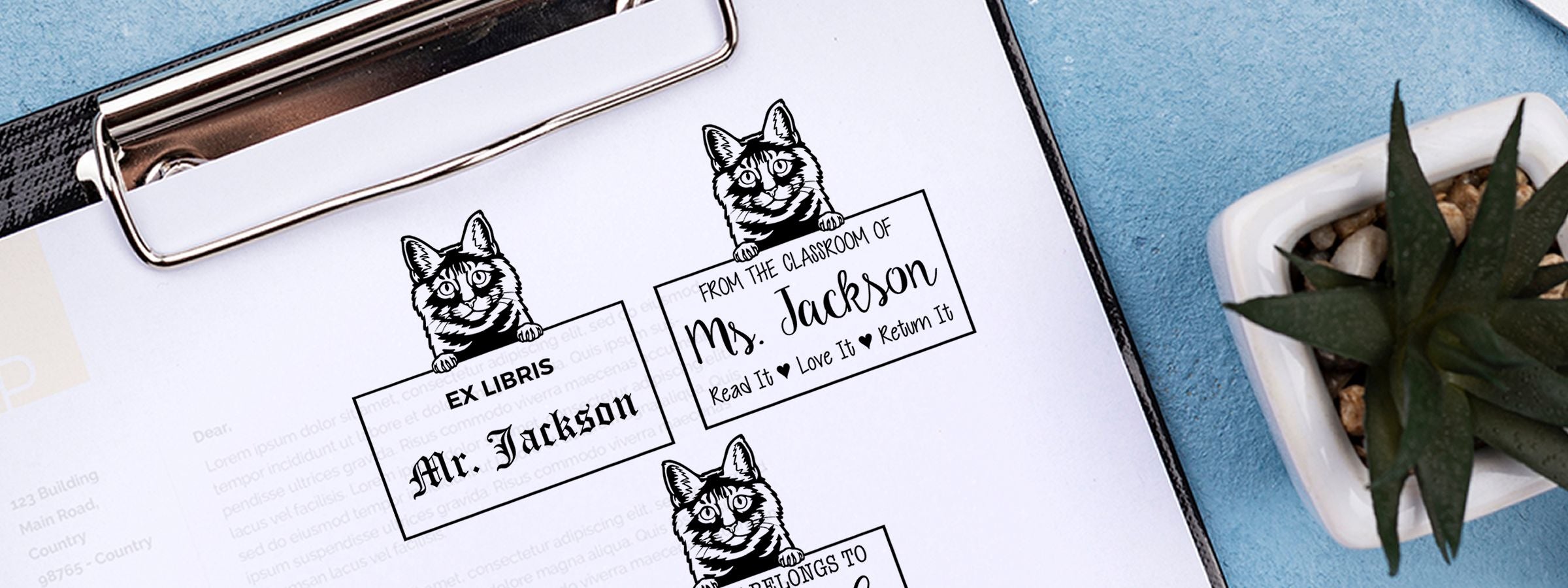 Clipboard with cat-themed bookplate labels and a potted succulent on blue, featuring Kurilian Bobtail Cat Stamps and Custom Seals.
