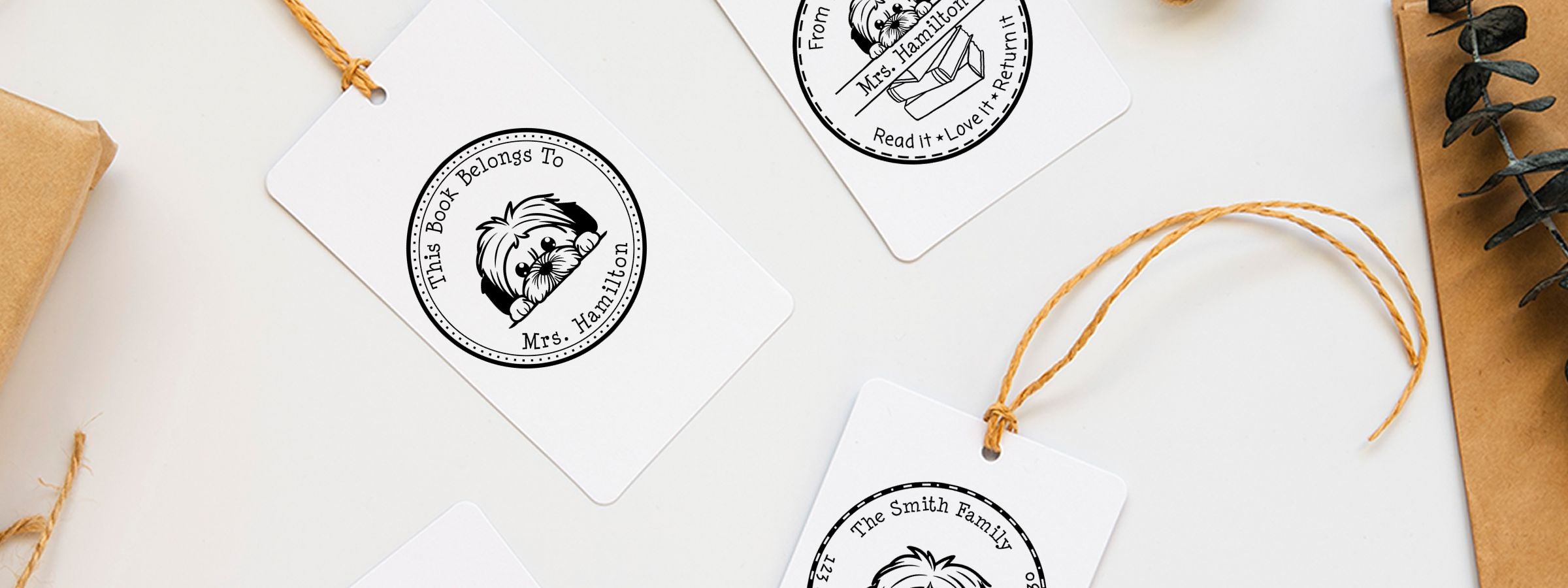 White gift tags with Lhasa Apso Dog Stamps and Custom Seals, black dog labels, twine, and personalized tags for Mrs. Hamilton and The Smith Family.