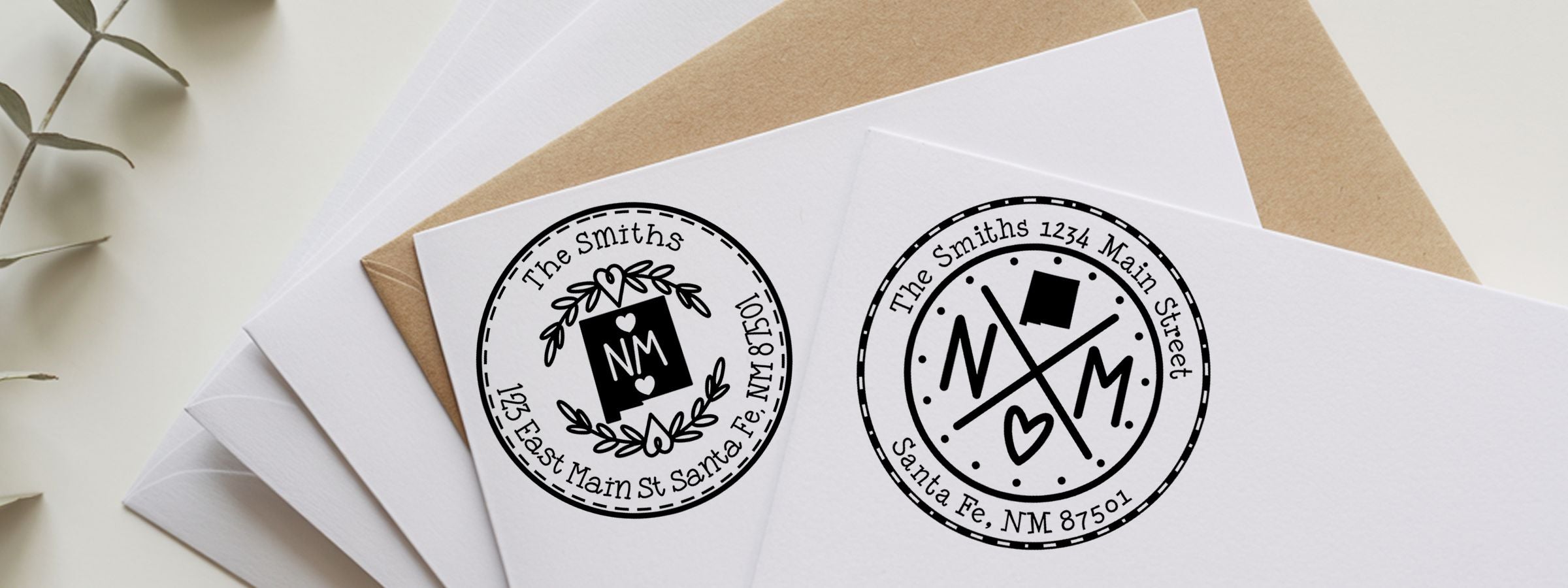 White and kraft envelopes with custom monogram address labels for The Smiths, featuring New Mexico Designer Stamps and Seals.
