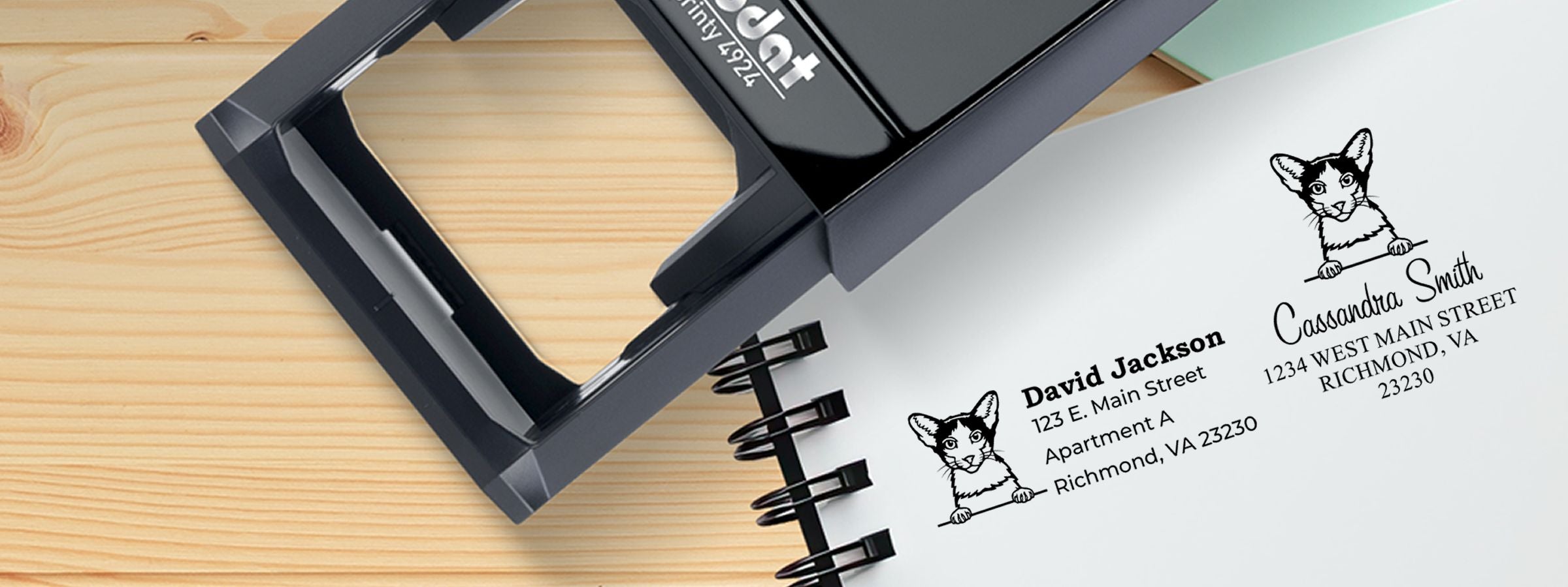 Black self-inking stamp beside custom cat-logo labels for David Jackson and Cassandra Smith, Oriental Bicolor Cat Stamps and Custom Seals.