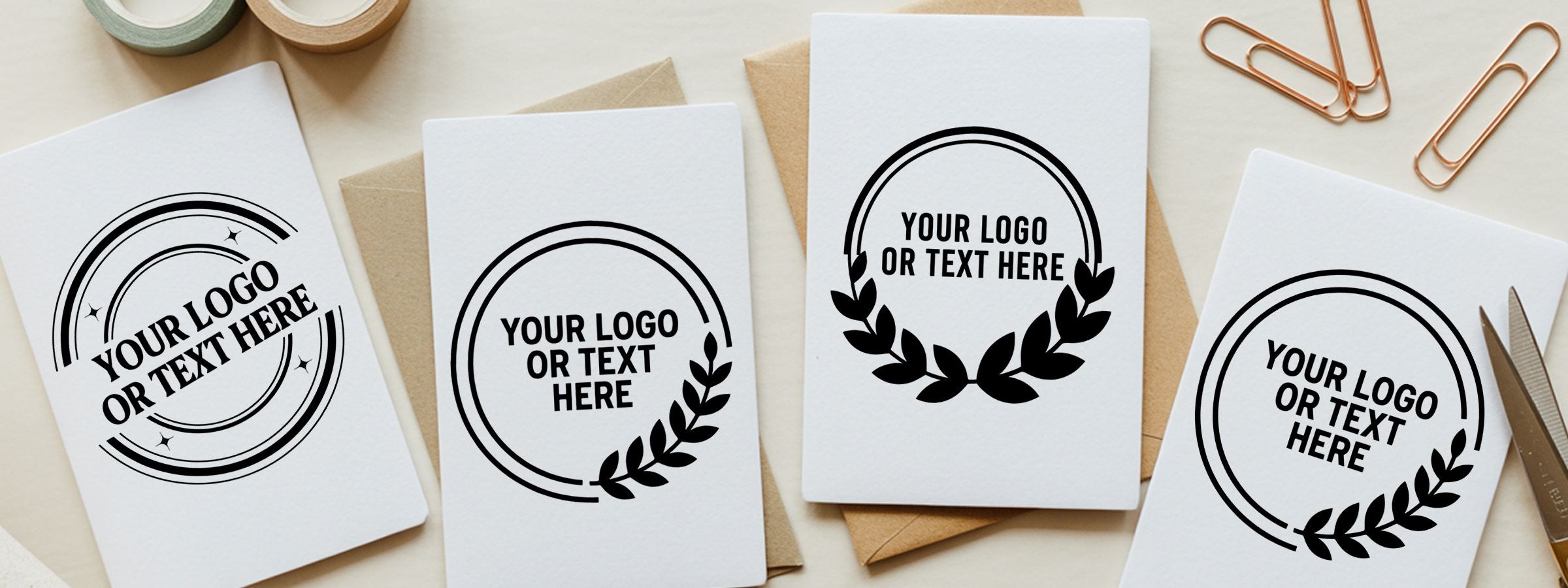 Flat lay of white stationery cards on beige envelopes with clips, scissors, and washi tape, featuring Custom Round Stamps mockups.