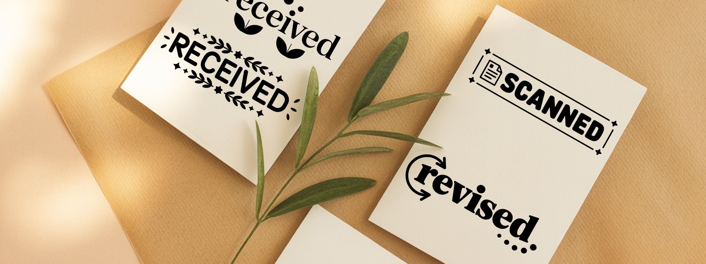 Scandonavian Stock Stamps: three white cards on beige reading received, scanned, revised, with a green plant stem.