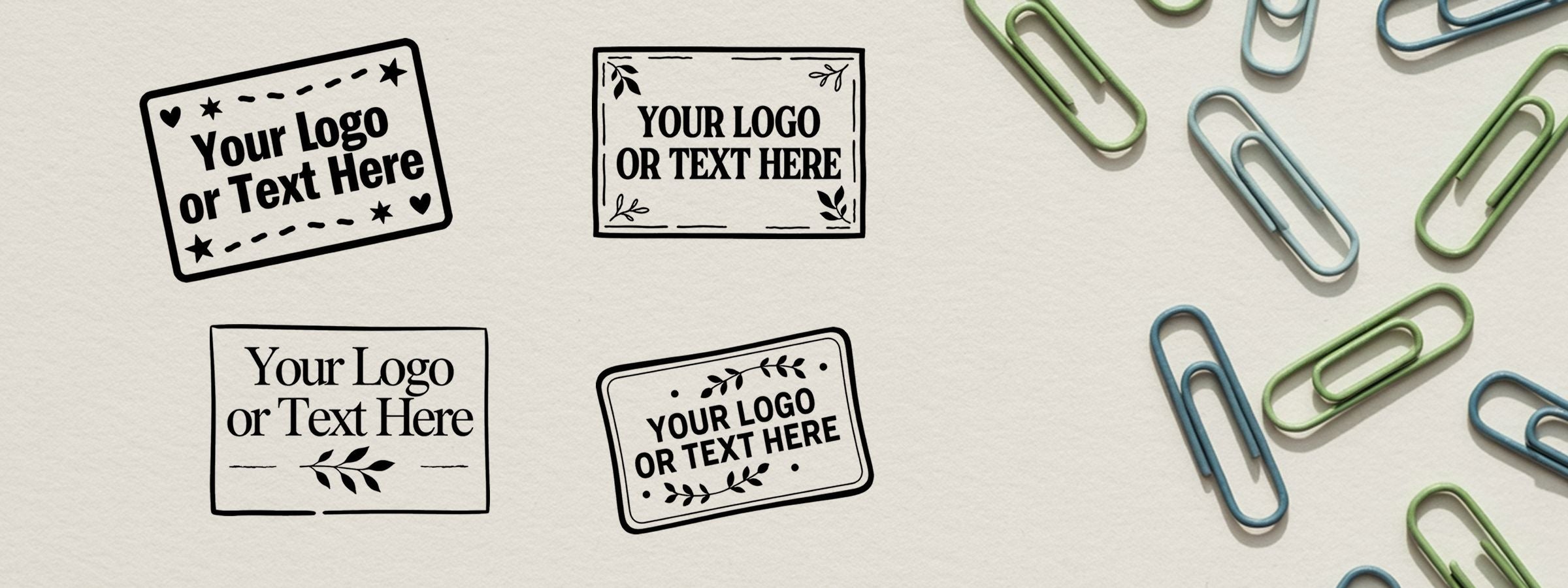 Small Custom Stamps mockup with four black-and-white logo labels and colorful paper clips on a light background.
