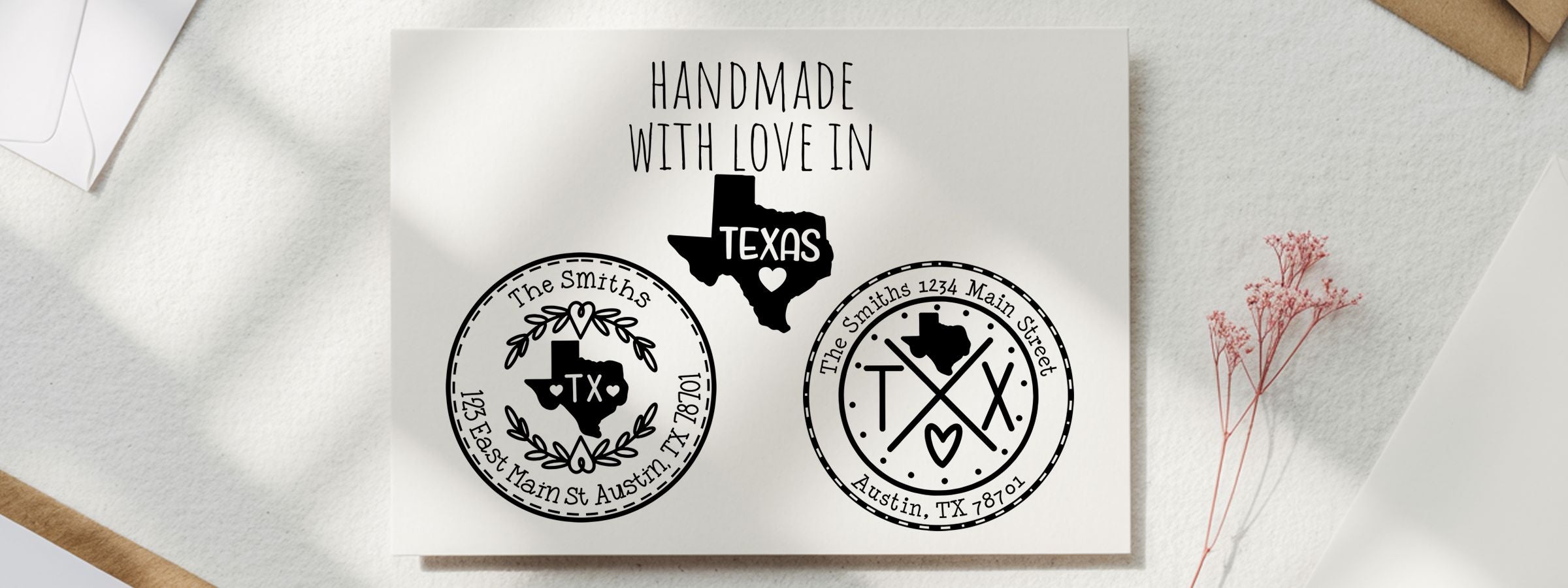 Greeting card mockup on white fabric with envelopes and dried flowers, featuring Texas Designer Stamps and Seals for The Smiths, Austin, TX 78701.