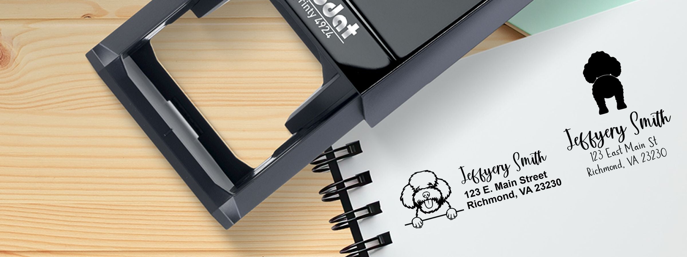 Black custom address stamp on wooden surface beside notebook with dog logo samples, Jeffery Smith, Richmond VA, for Toy Poodle Dog Stamps and Custom Seals.