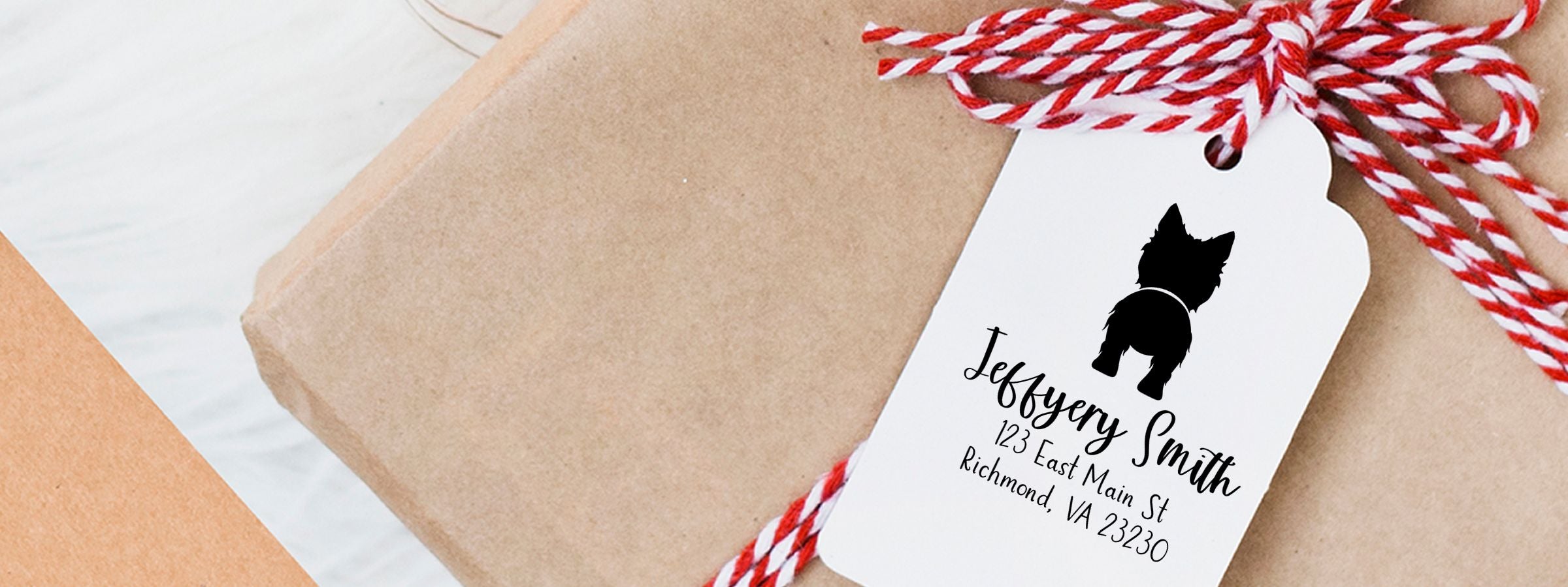 Wrapped gift box with personalized tag, black dog silhouette and Jeffery Smith, red-and-white twine, West Highland White Terrier Dog Stamps and Custom Seals