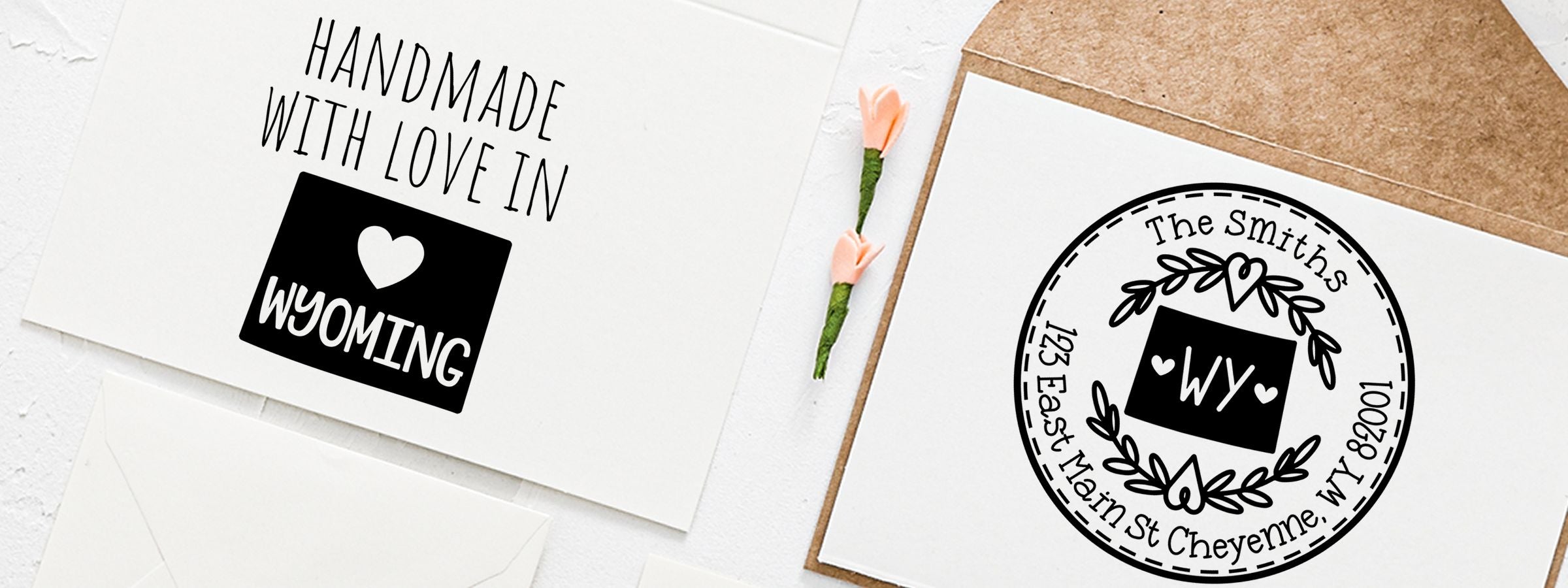 Wyoming Designer Stamps and Seals on two handmade cards with white envelopes, one saying “Handmade with Love in Wyoming” and one WY monogram.