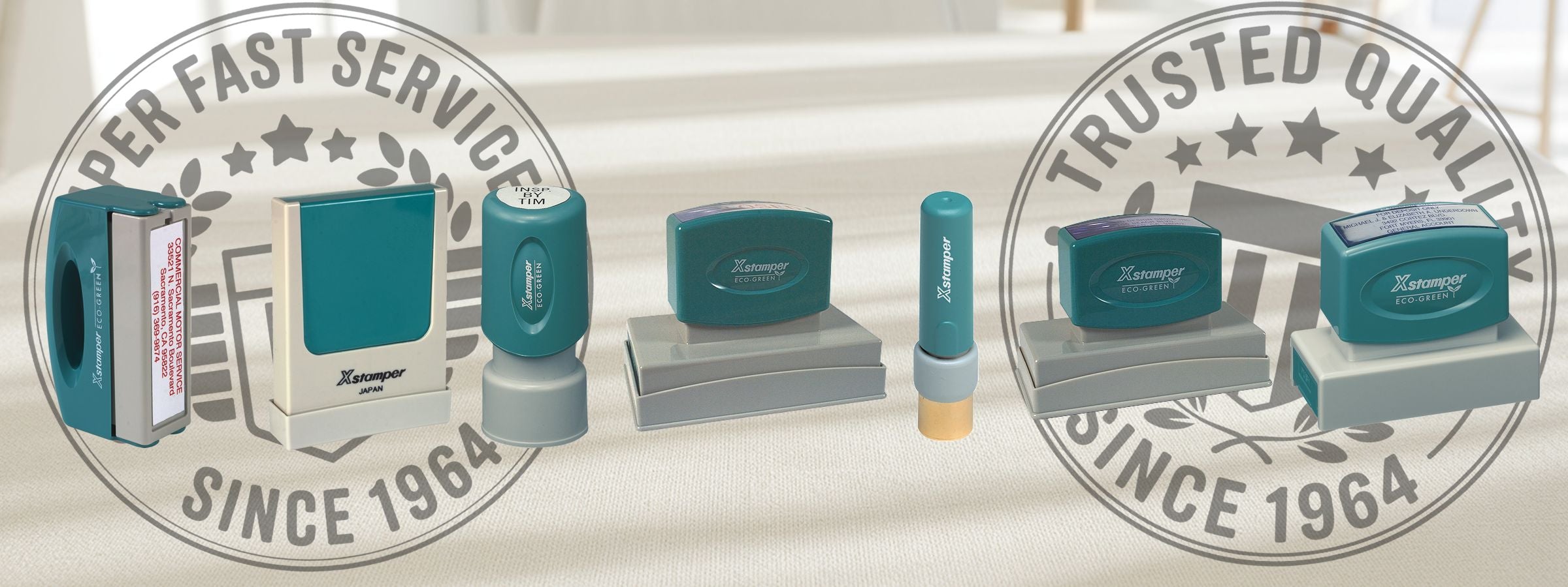 Custom Xstamper Stamps lineup of teal and gray self-inking stamps with Super Fast Service and Trusted Quality Since 1964 logos.