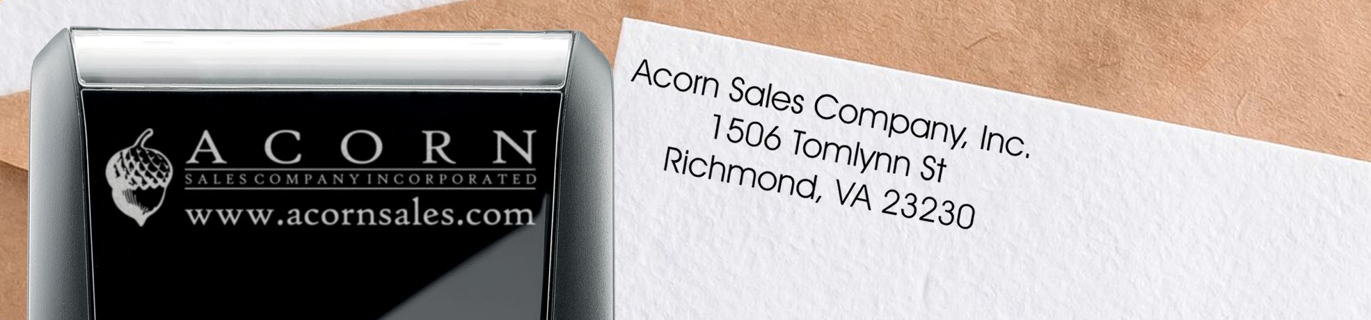 Address Stamps: Self-inking stamp beside envelope with Acorn Sales Company logo, website, and return address.