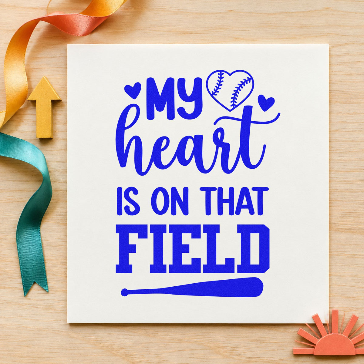 Heart on the Field Bat craft stamp imprinted in blue ink on paper, a design suited to journal page headers.