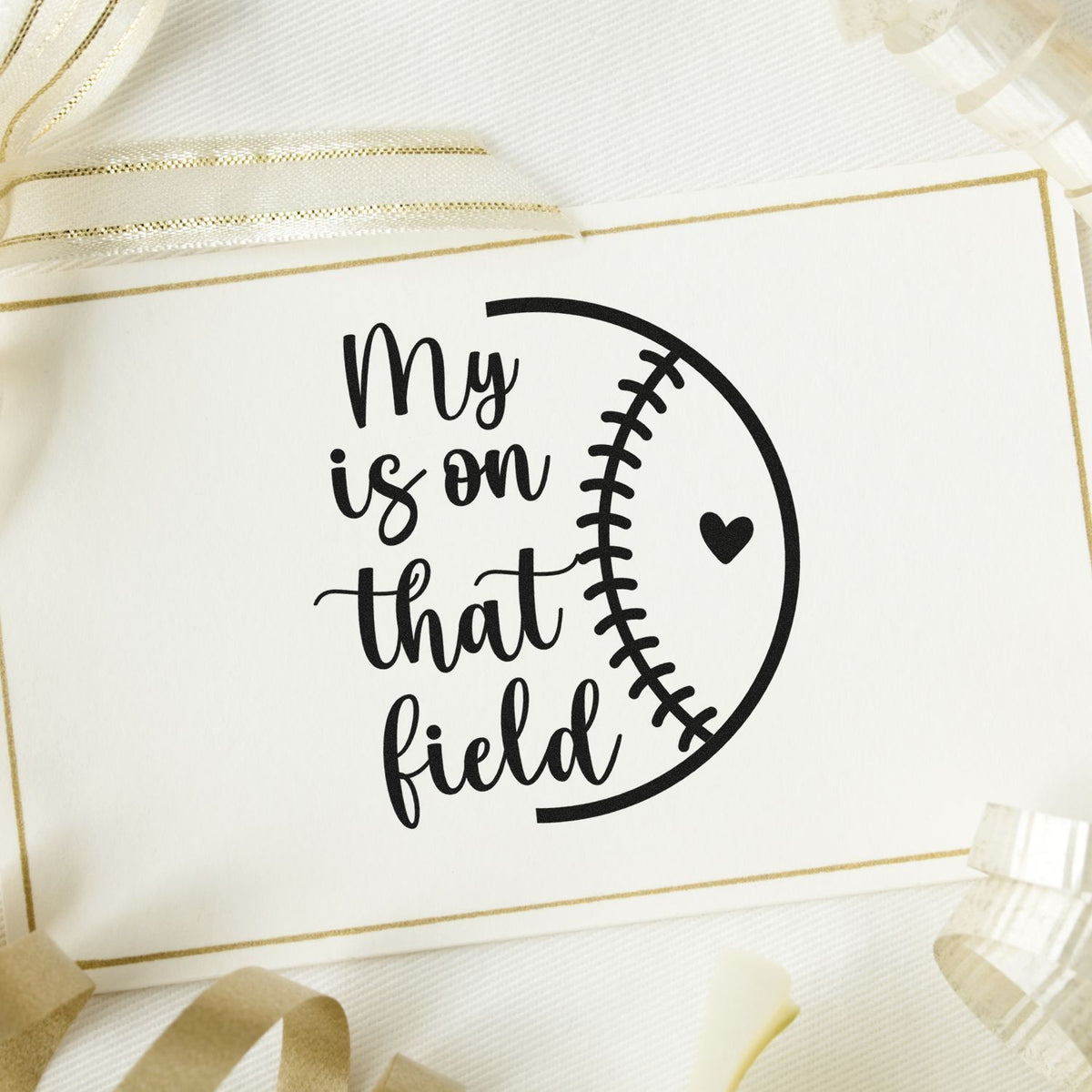 Baseball rubber stamp design with My is on that field text and heart inside a stitched baseball graphic.