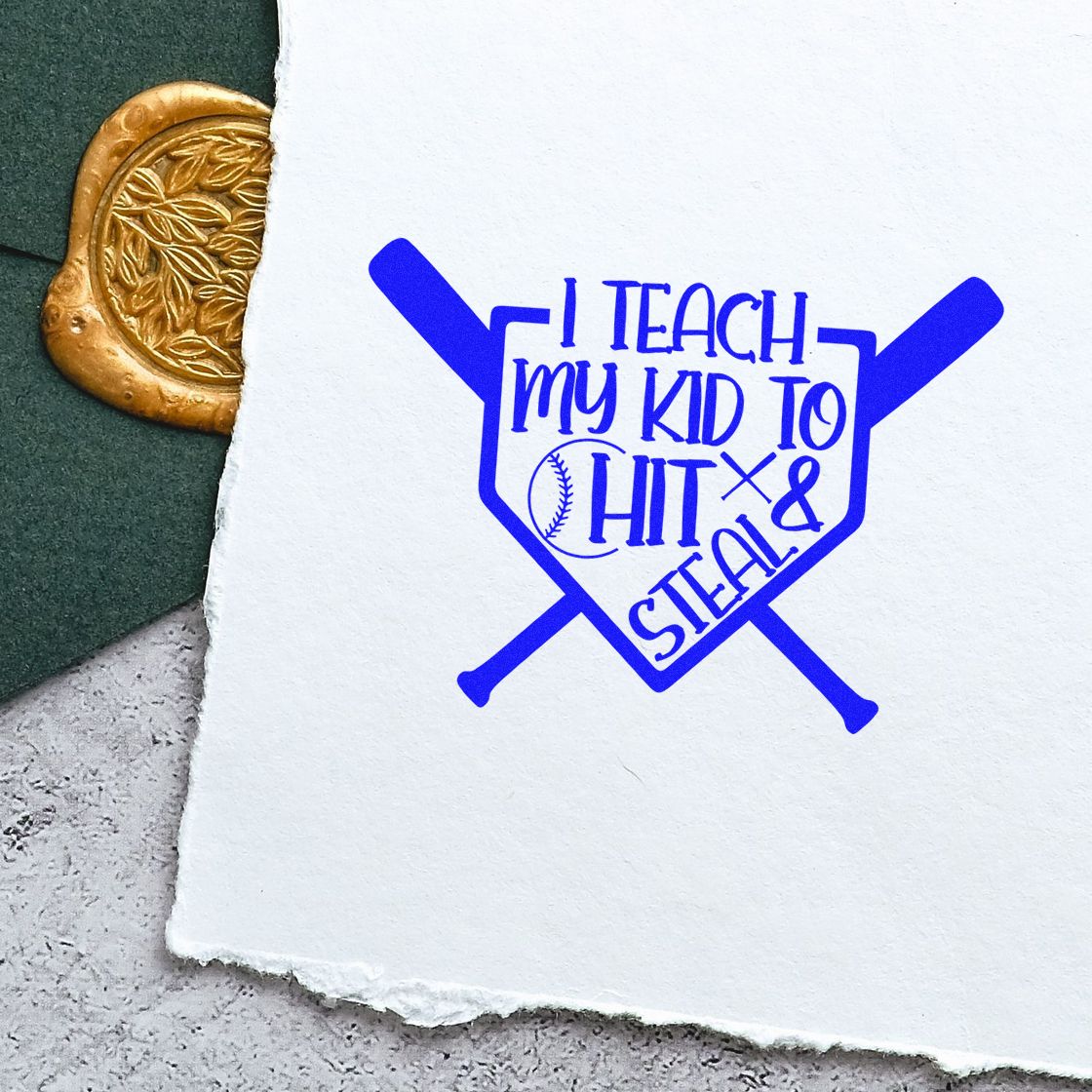 Baseball rubber stamp impression reading I teach my kid to hit & steal with bats and ball on paper.