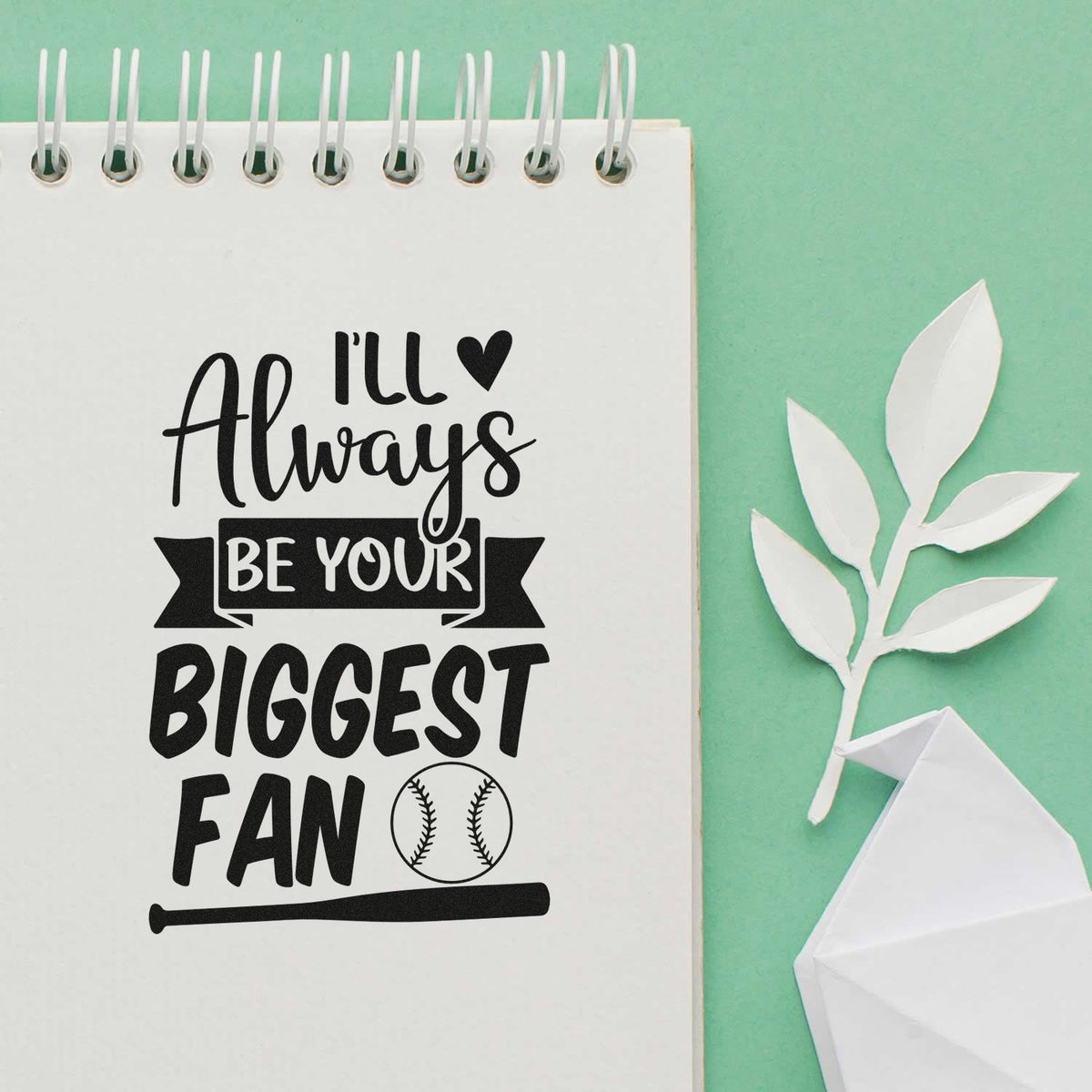 I'll Always Be Your Biggest Fan Pre-Inked Stamp – PSI imprint stamped in black ink. Mixed lettering reads "I'll always be your biggest fan," with a ribbon, hearts, baseball, and bat.